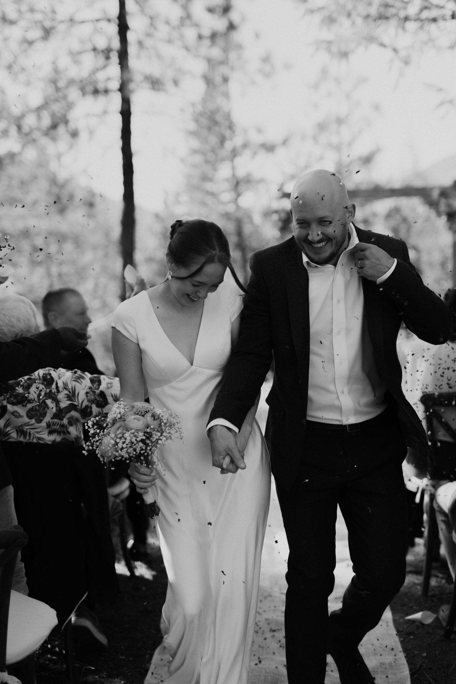 bride and groom doing a ceremony exit with petal tossing