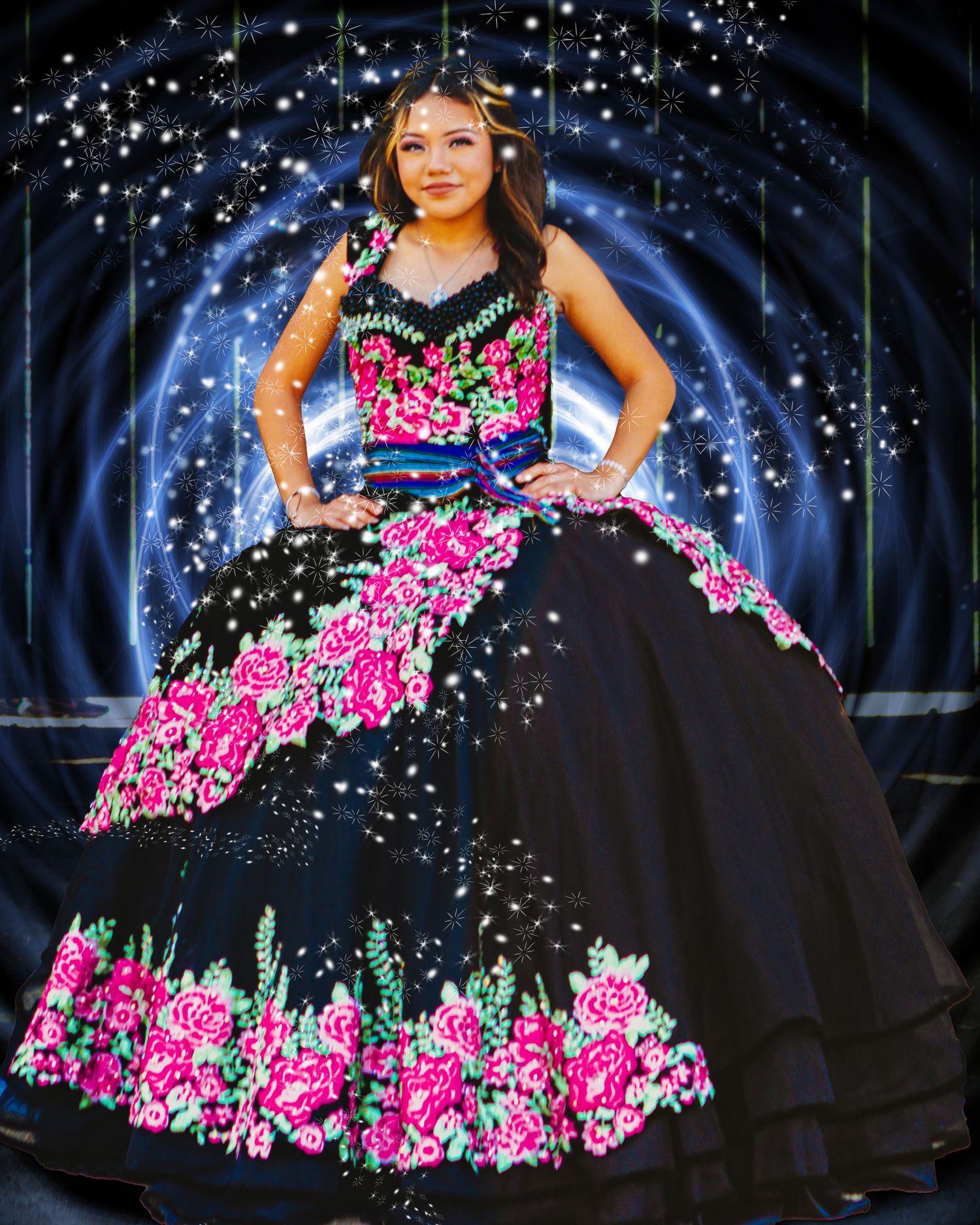 Elegant ball gown in black with vibrant pink floral embroidery photographed against a sparkly dark blue backdrop.