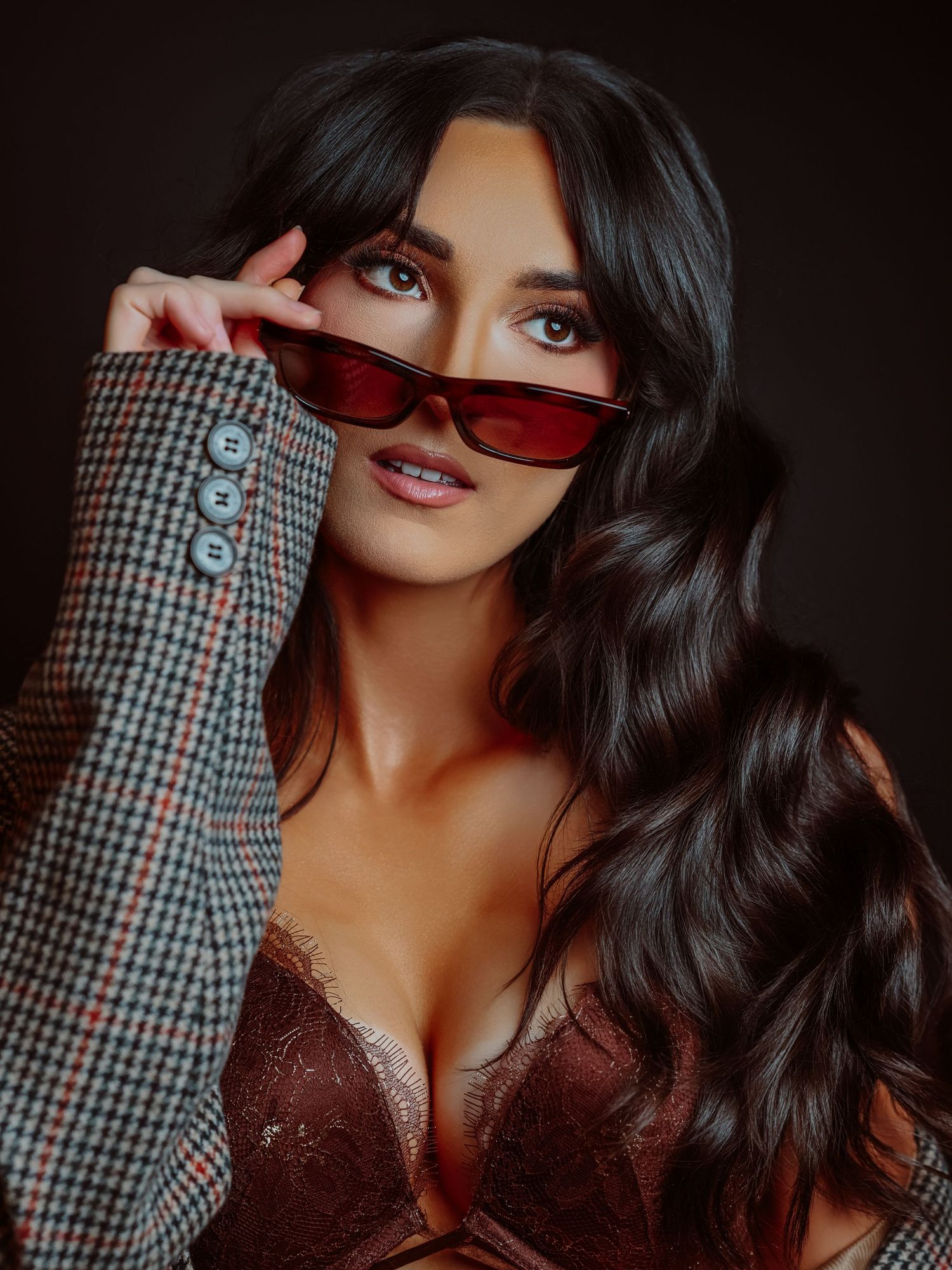 High fashion vibe editorial photoshoot with sunglasses, browns and blacks, spray tan, headshots for Boudoir by Bri in Saint Louis Missouri