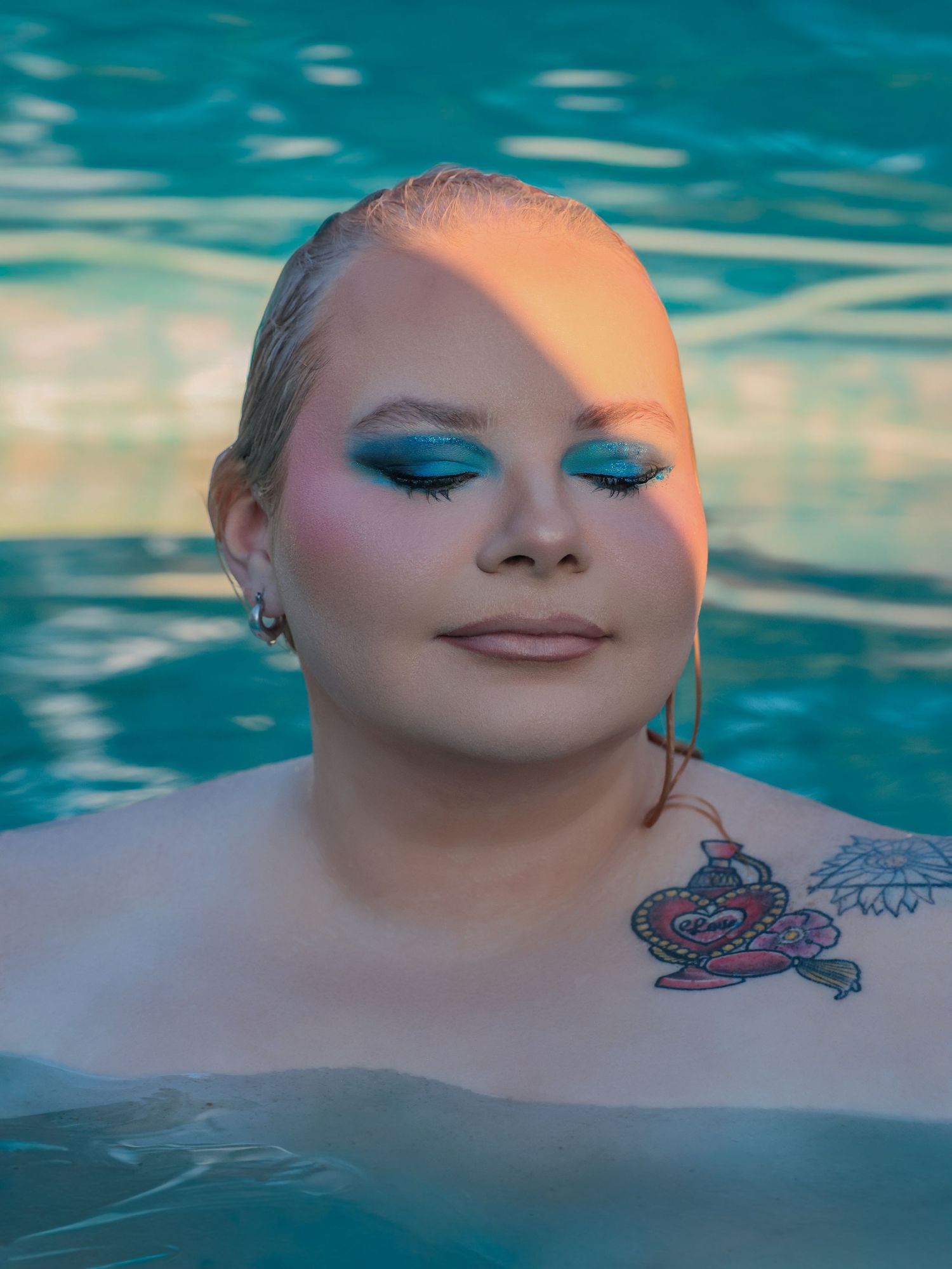 Outdoor boudoir photoshoot in water with dramatic style by Boudoir by Bri in St. Louis Missouri