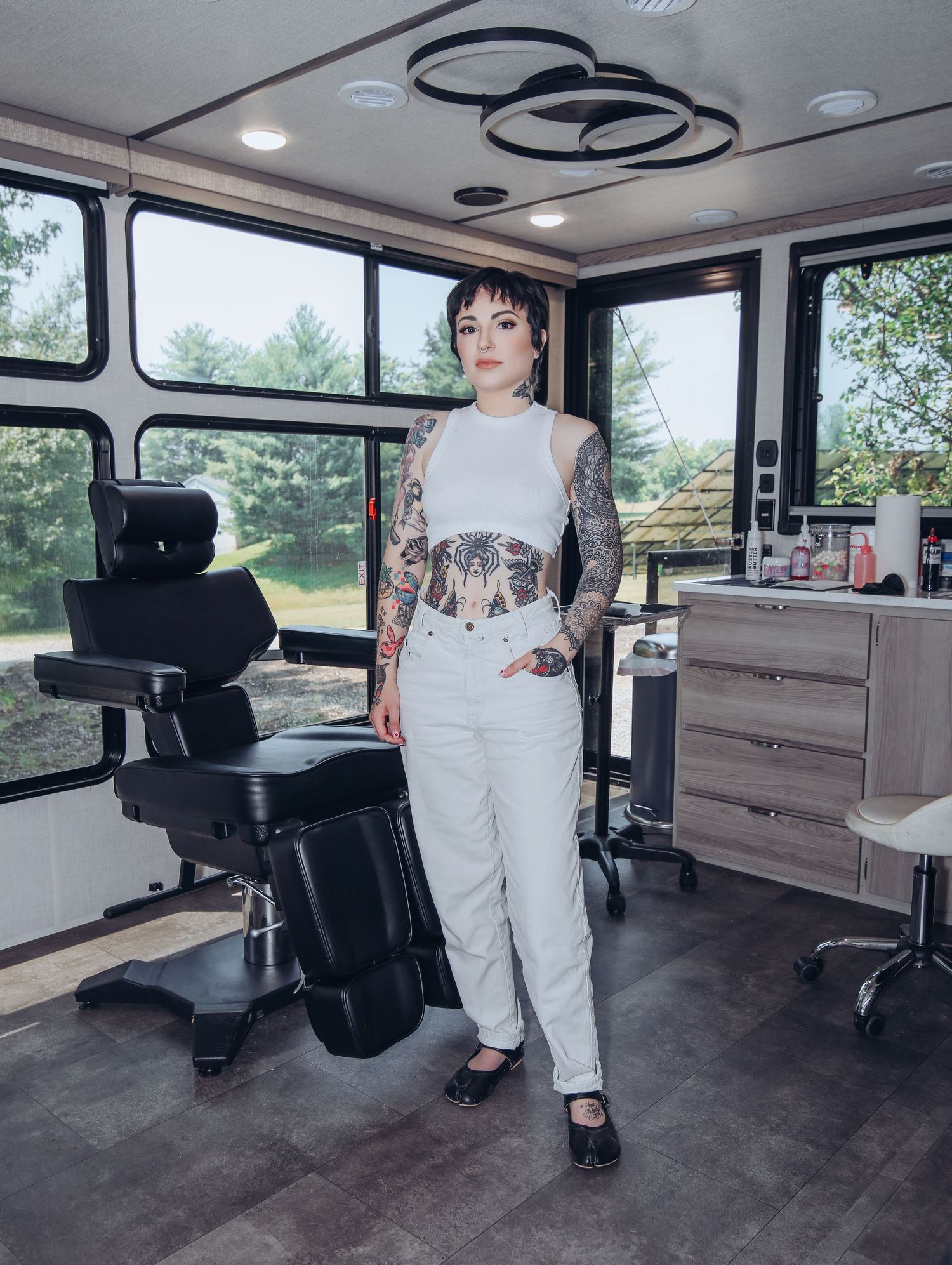 Boudoir by Bri photoshoot of small business branding and headshots for tattoo artist in St. Louis on location, young tattooed artist