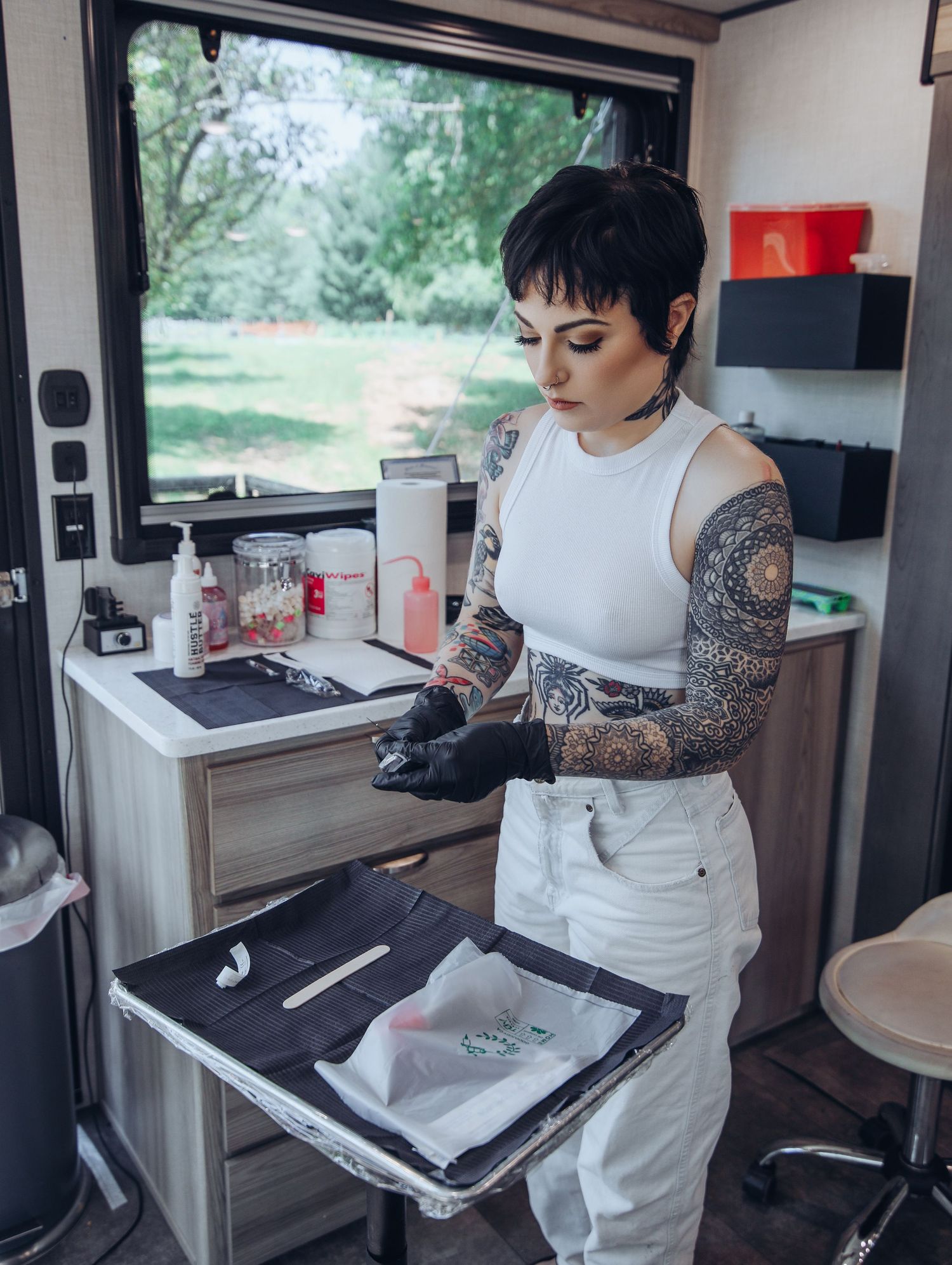 Boudoir by Bri photoshoot of small business branding and headshots for tattoo artist in St. Louis on location, young tattooed artist