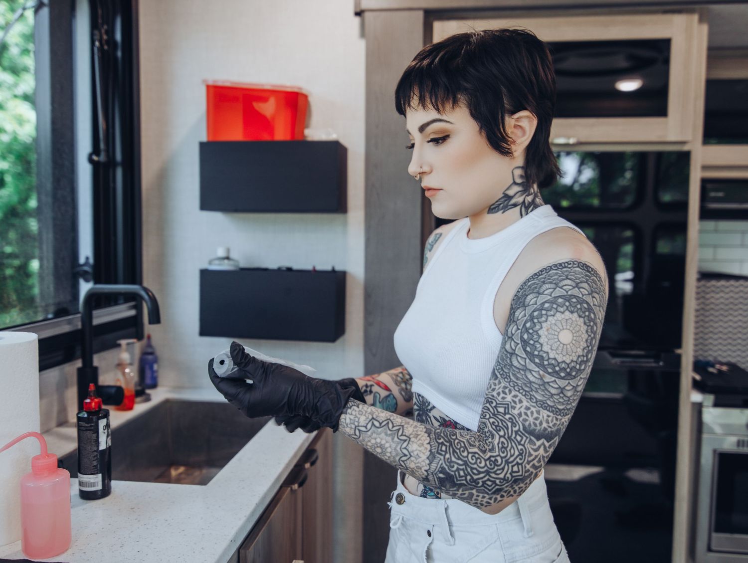 Boudoir by Bri photoshoot of small business branding and headshots for tattoo artist in St. Louis on location, young tattooed artist