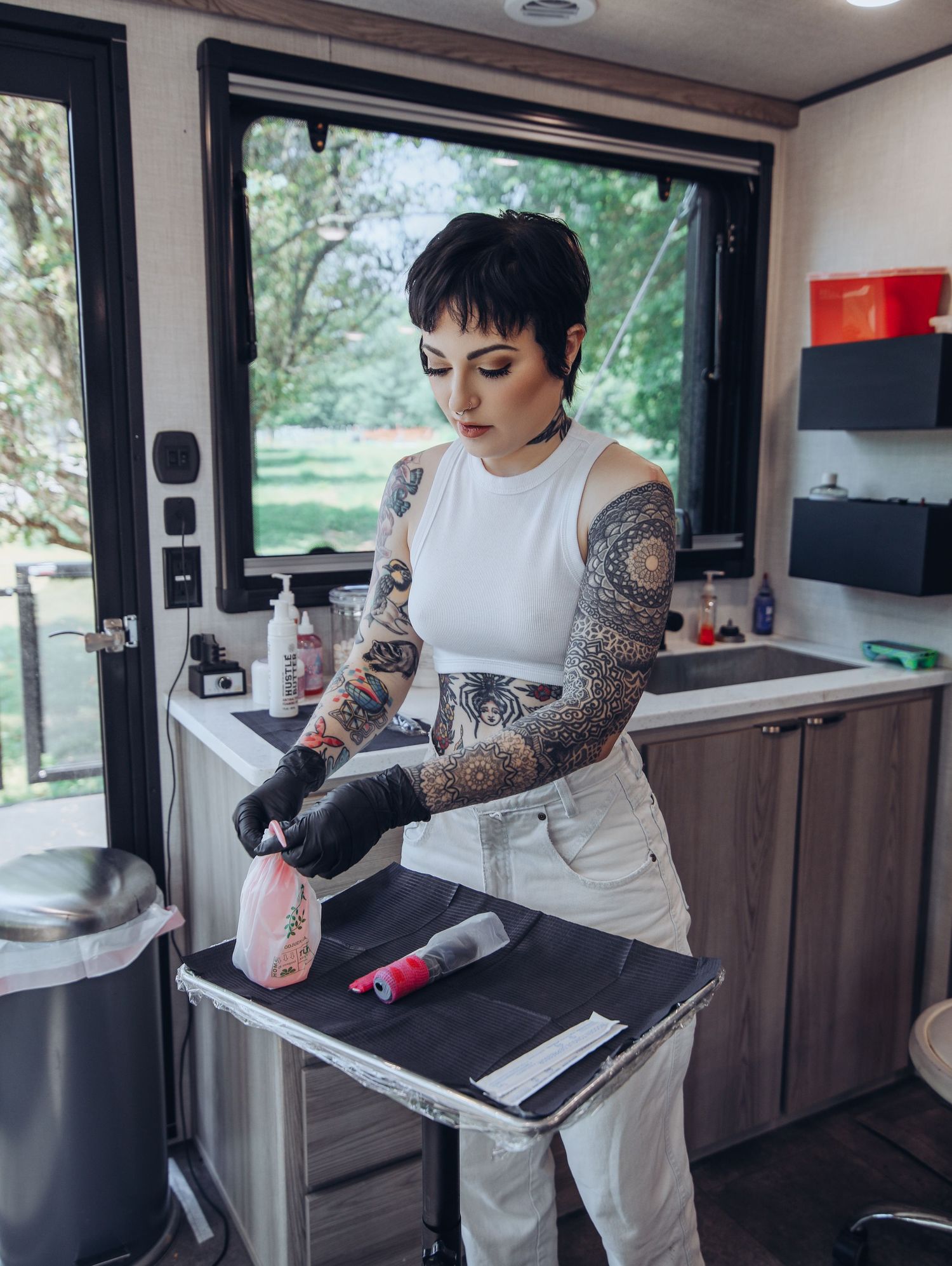 Boudoir by Bri photoshoot of small business branding and headshots for tattoo artist in St. Louis on location, young tattooed artist