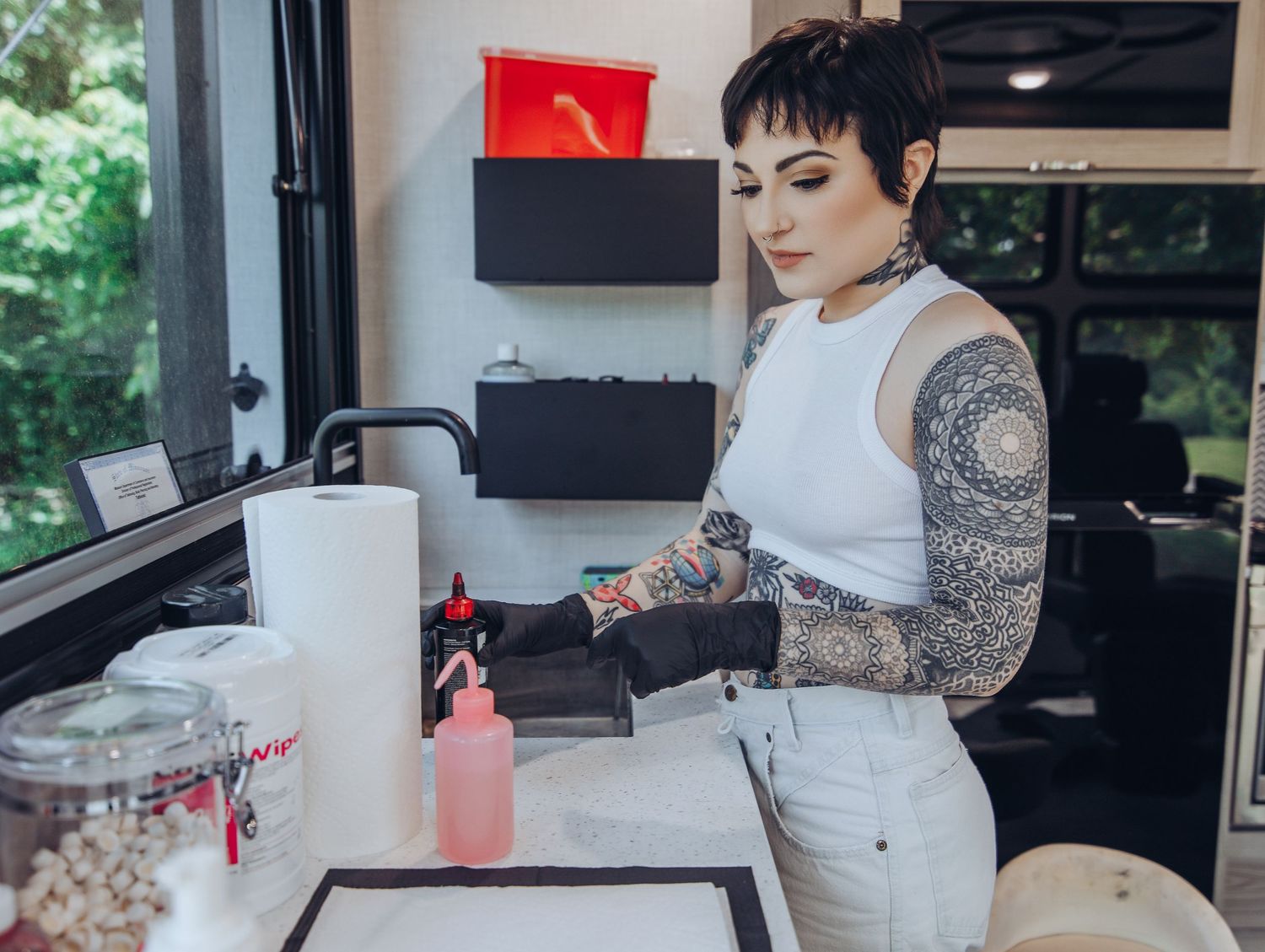 Boudoir by Bri photoshoot of small business branding and headshots for tattoo artist in St. Louis on location, young tattooed artist