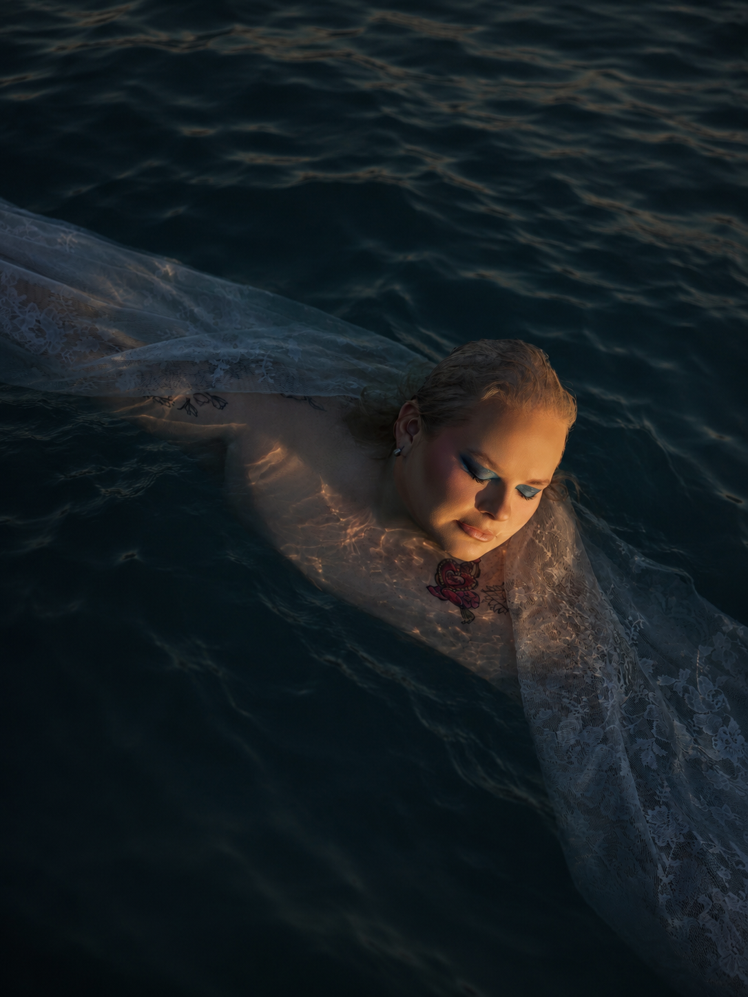 Outdoor boudoir photoshoot in water with dramatic style by Boudoir by Bri in St. Louis Missouri