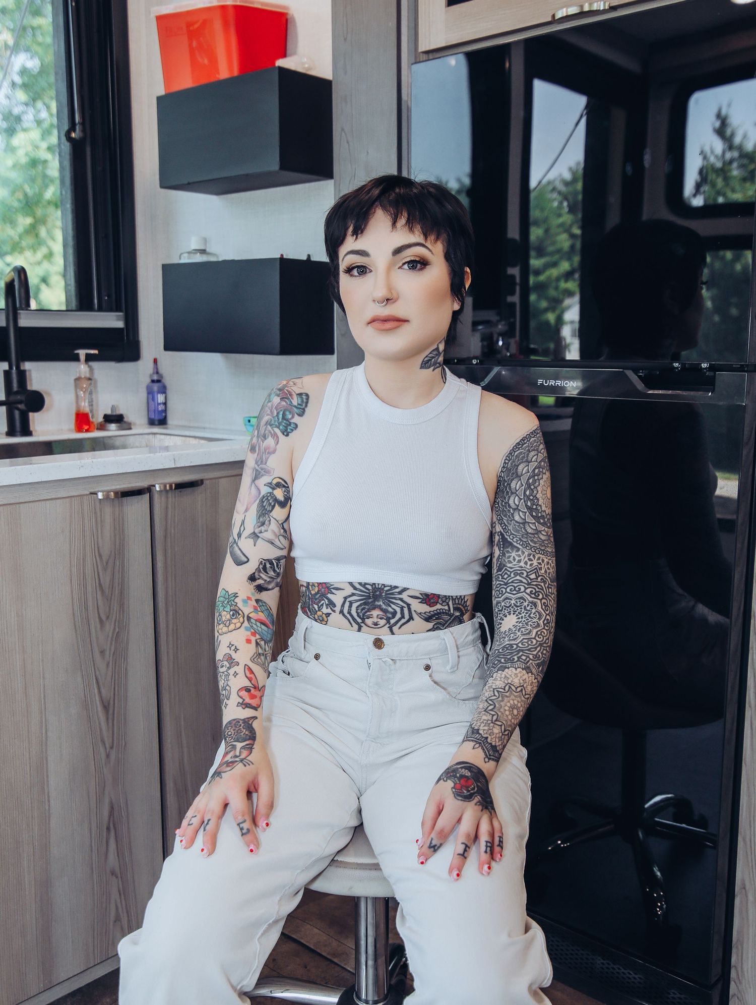 Boudoir by Bri photoshoot of small business branding and headshots for tattoo artist in St. Louis on location, young tattooed artist