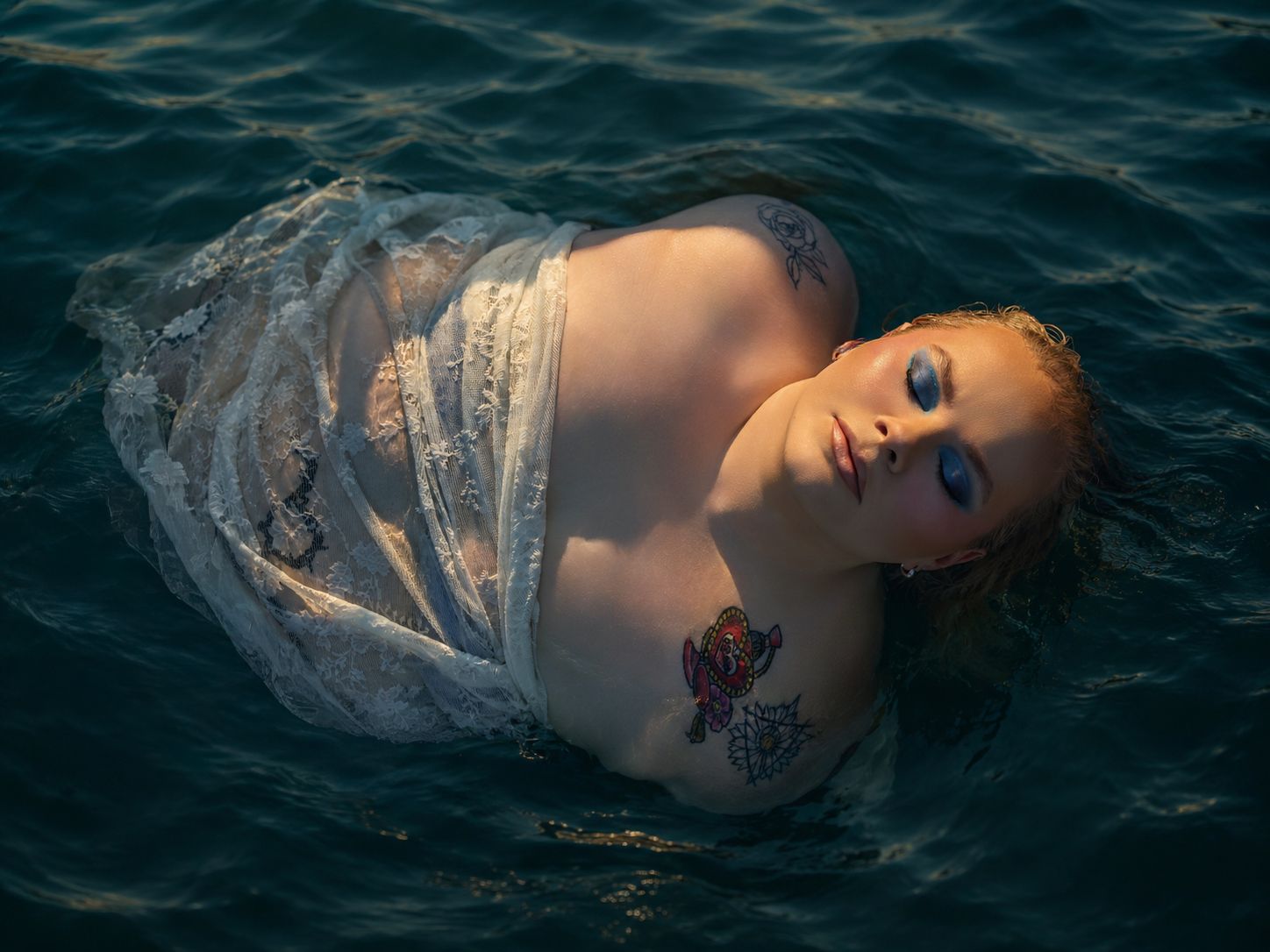 Outdoor boudoir photoshoot in water with dramatic style by Boudoir by Bri in St. Louis Missouri