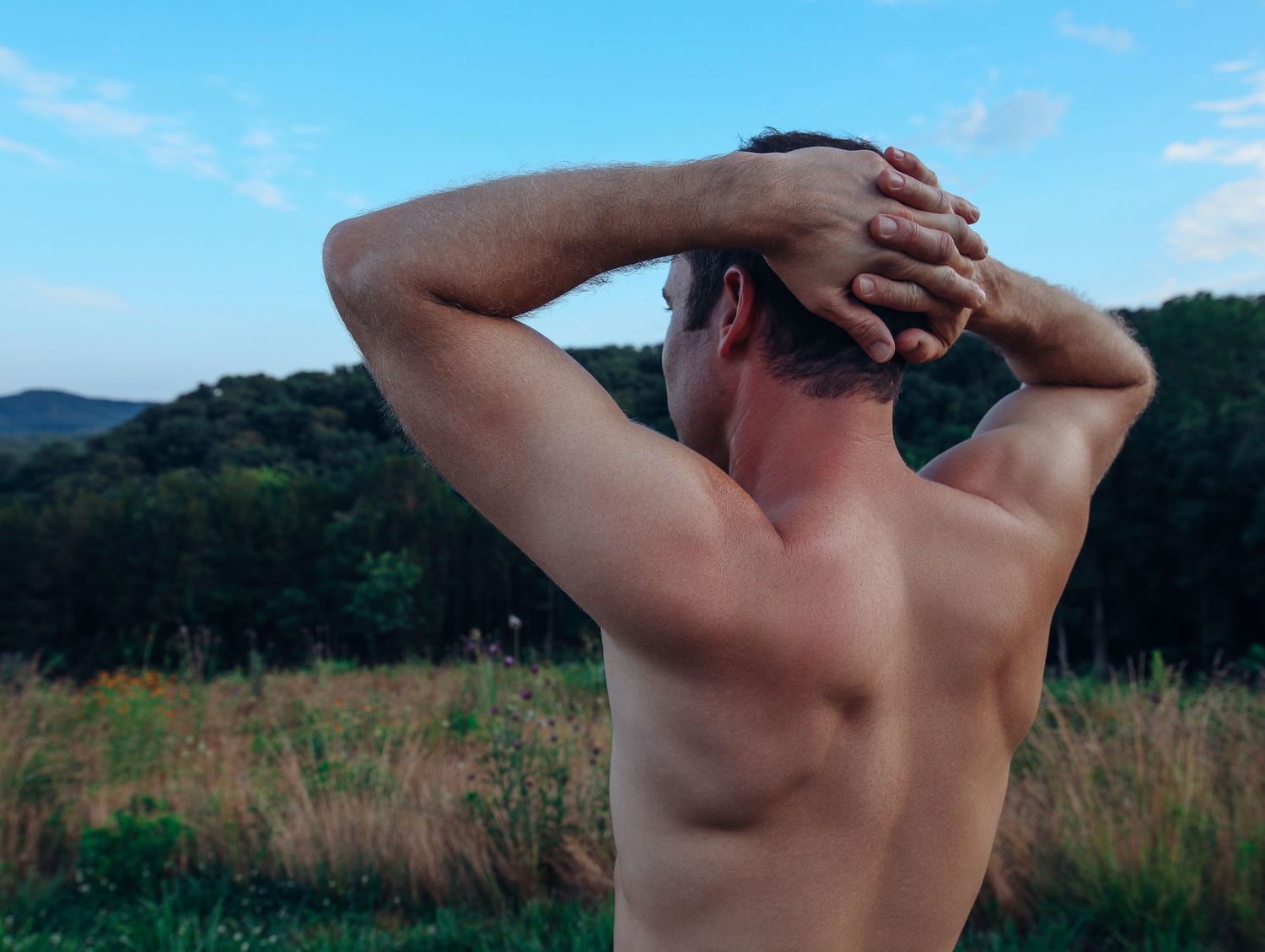 Male Boudoir Outdoor photoshoot shirtless close up detailed muscles in back, arms with mountain and fields with Boudoir by Bri St. Louis