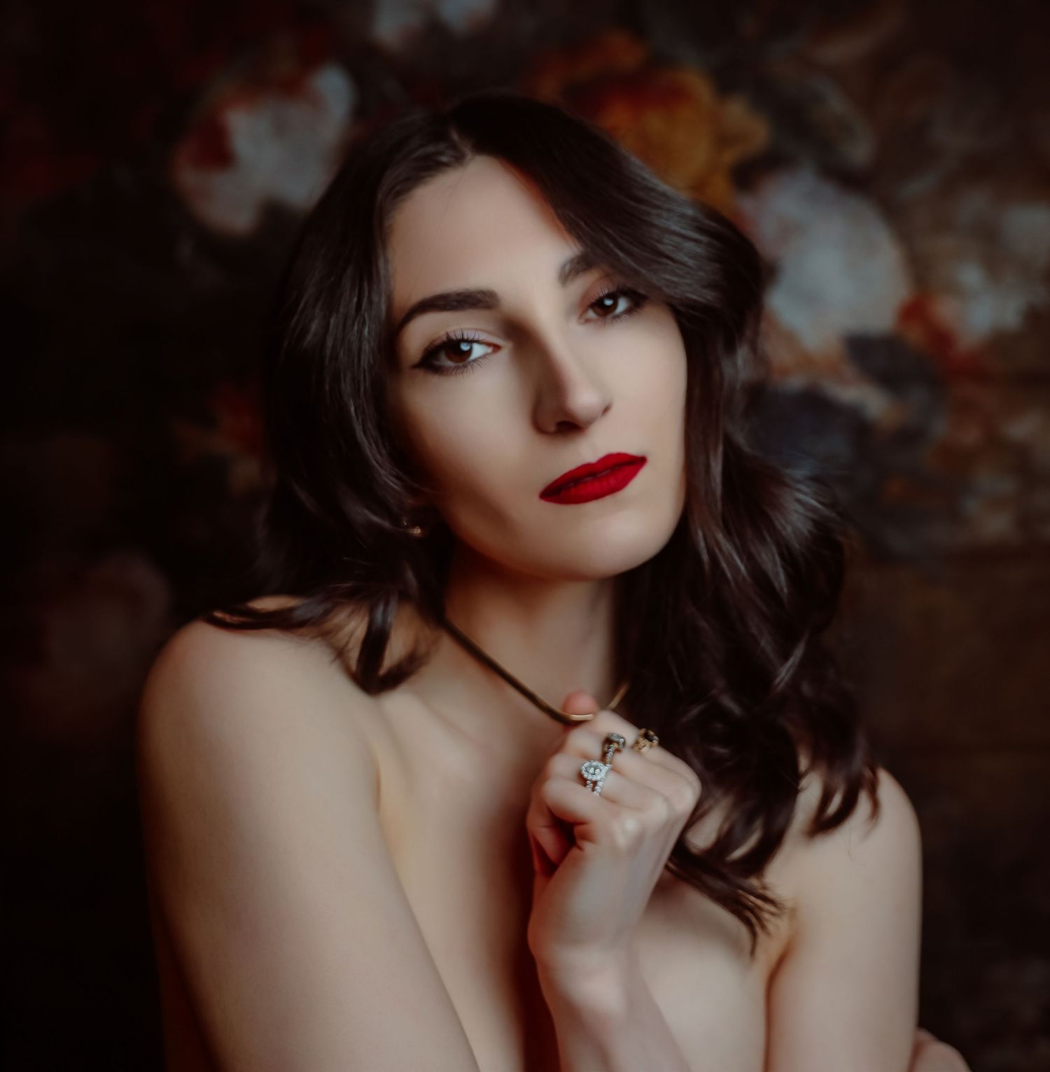 Glamour headshot portrait of young woman nude with gold necklace, rings, black hair, and red lipstick for photoshoot with Boudoir by Bri