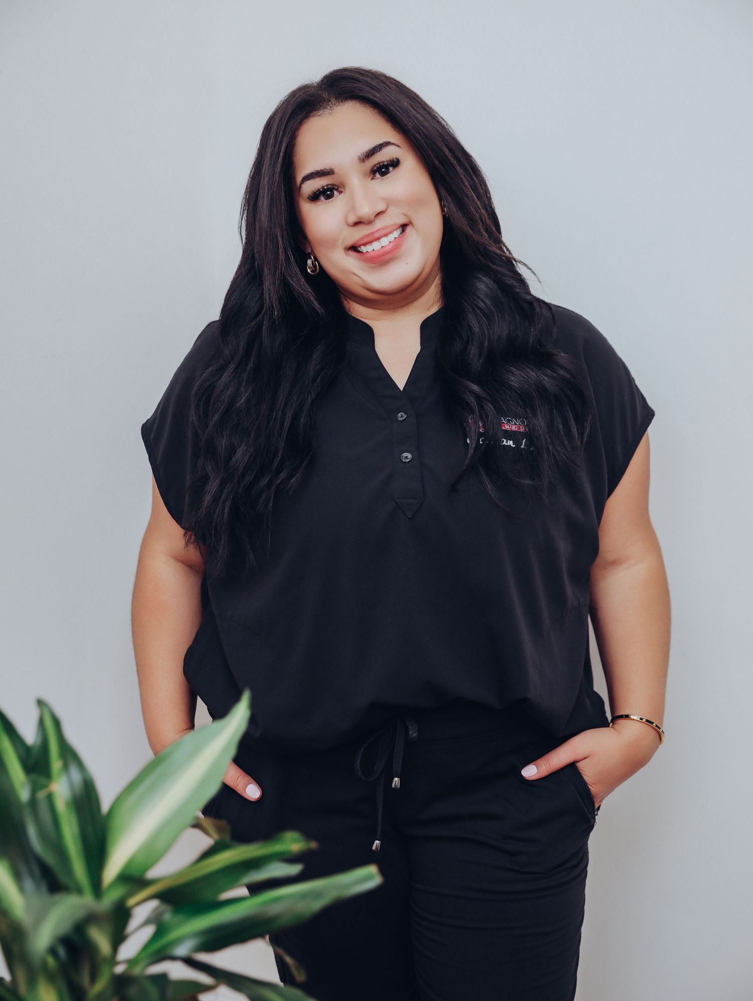 Boudoir by Bri photoshoot of small business branding and headshots for esthetician in St. Louis, in studio and wearing scrubs, skincare