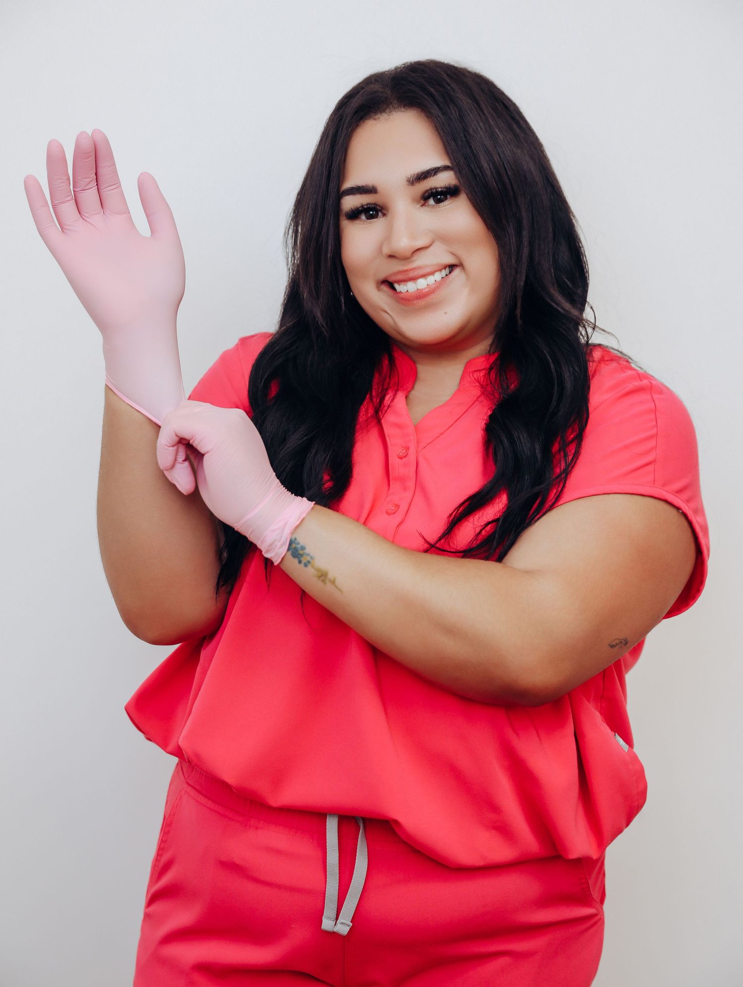 Boudoir by Bri photoshoot of small business branding and headshots for esthetician in St. Louis, in studio and wearing scrubs, skincare