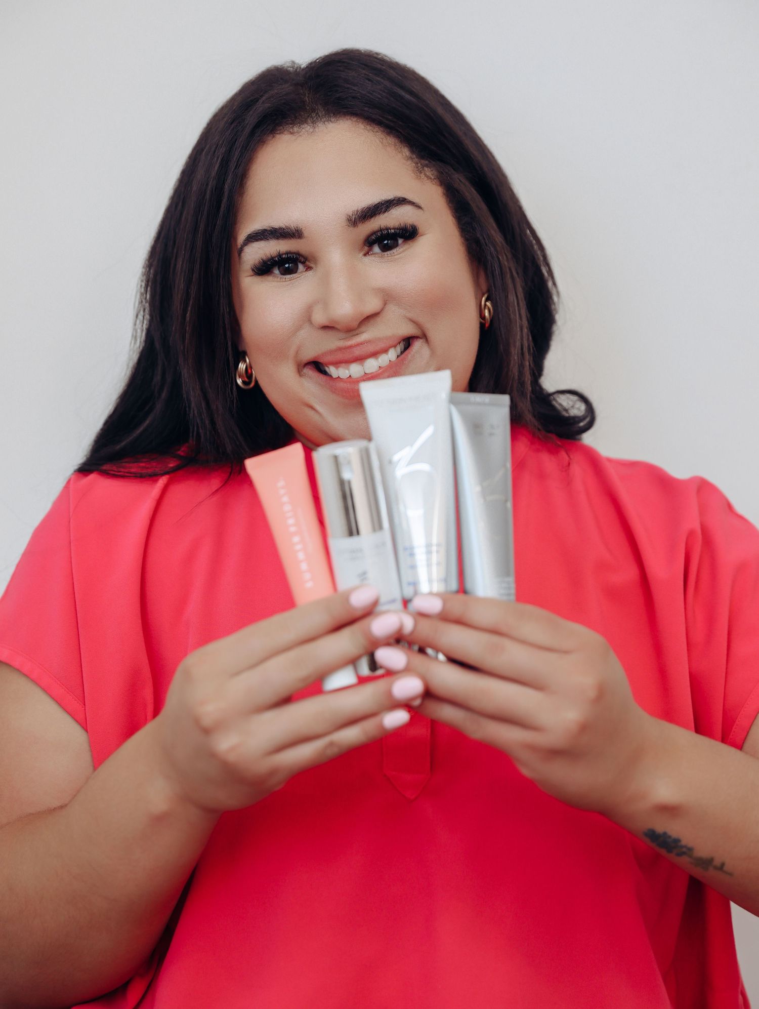 Boudoir by Bri photoshoot of small business branding and headshots for esthetician in St. Louis, in studio and wearing scrubs, skincare