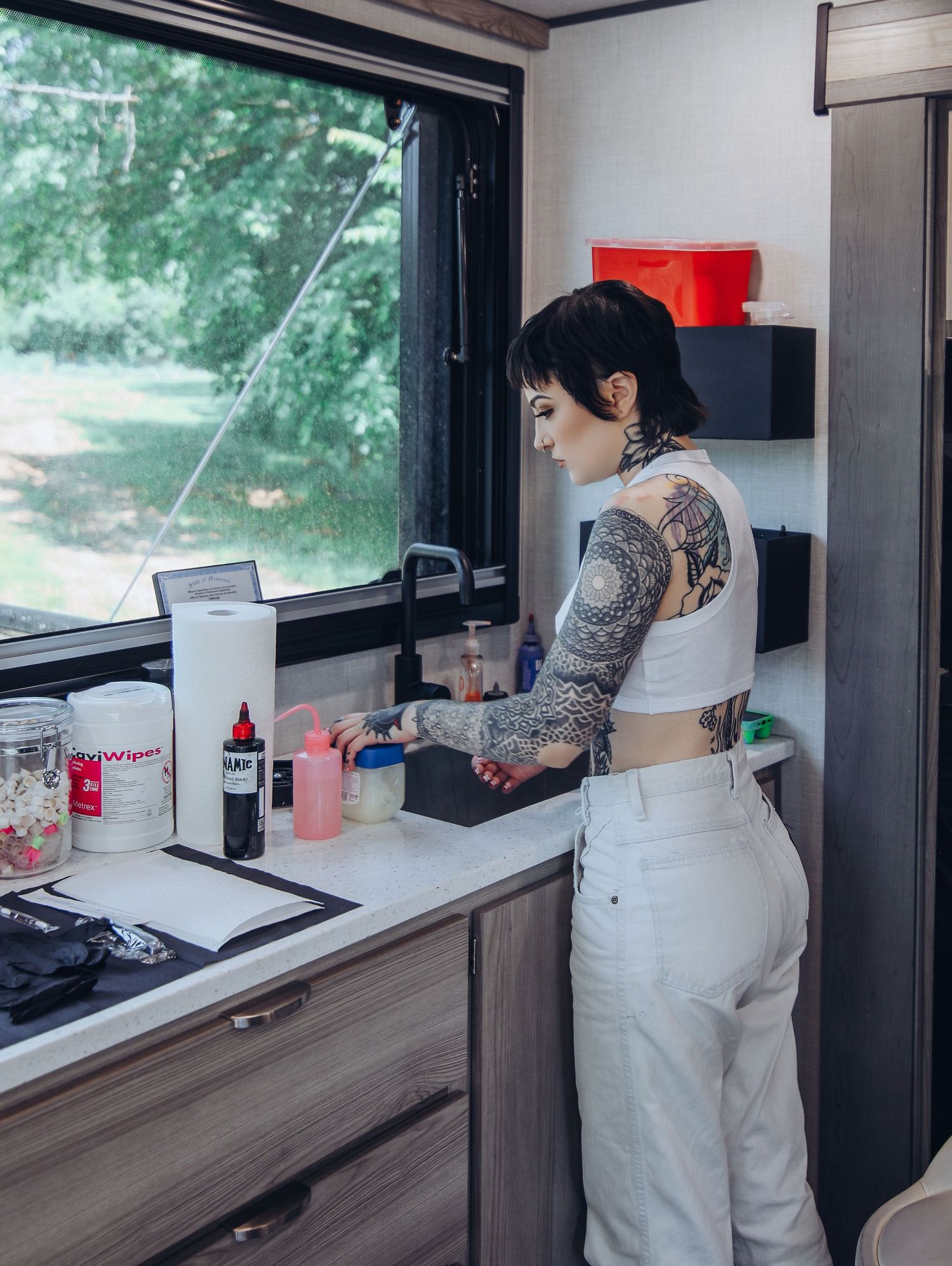 Boudoir by Bri photoshoot of small business branding and headshots for tattoo artist in St. Louis on location, young tattooed artist