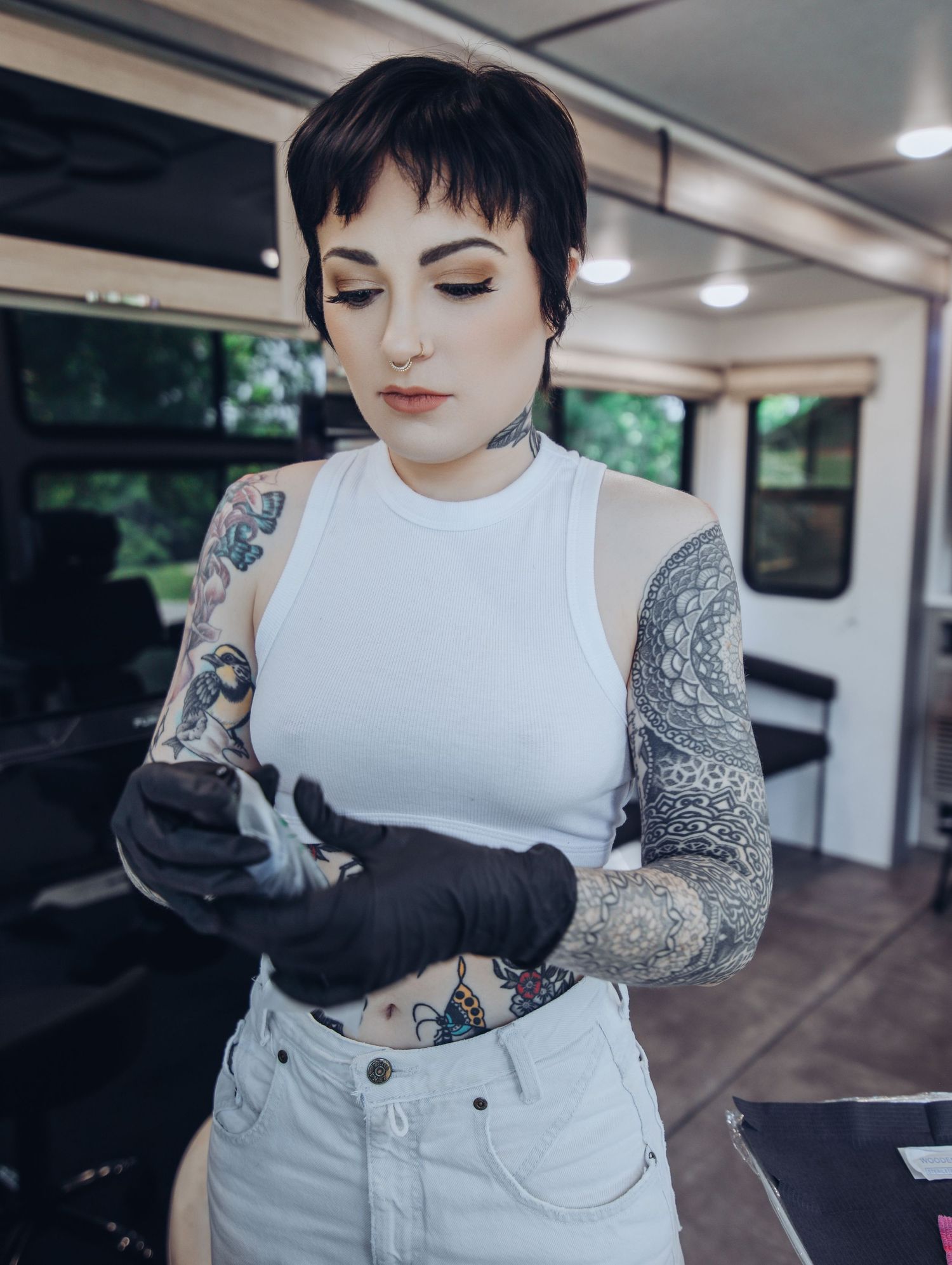 Boudoir by Bri photoshoot of small business branding and headshots for tattoo artist in St. Louis on location, young tattooed artist