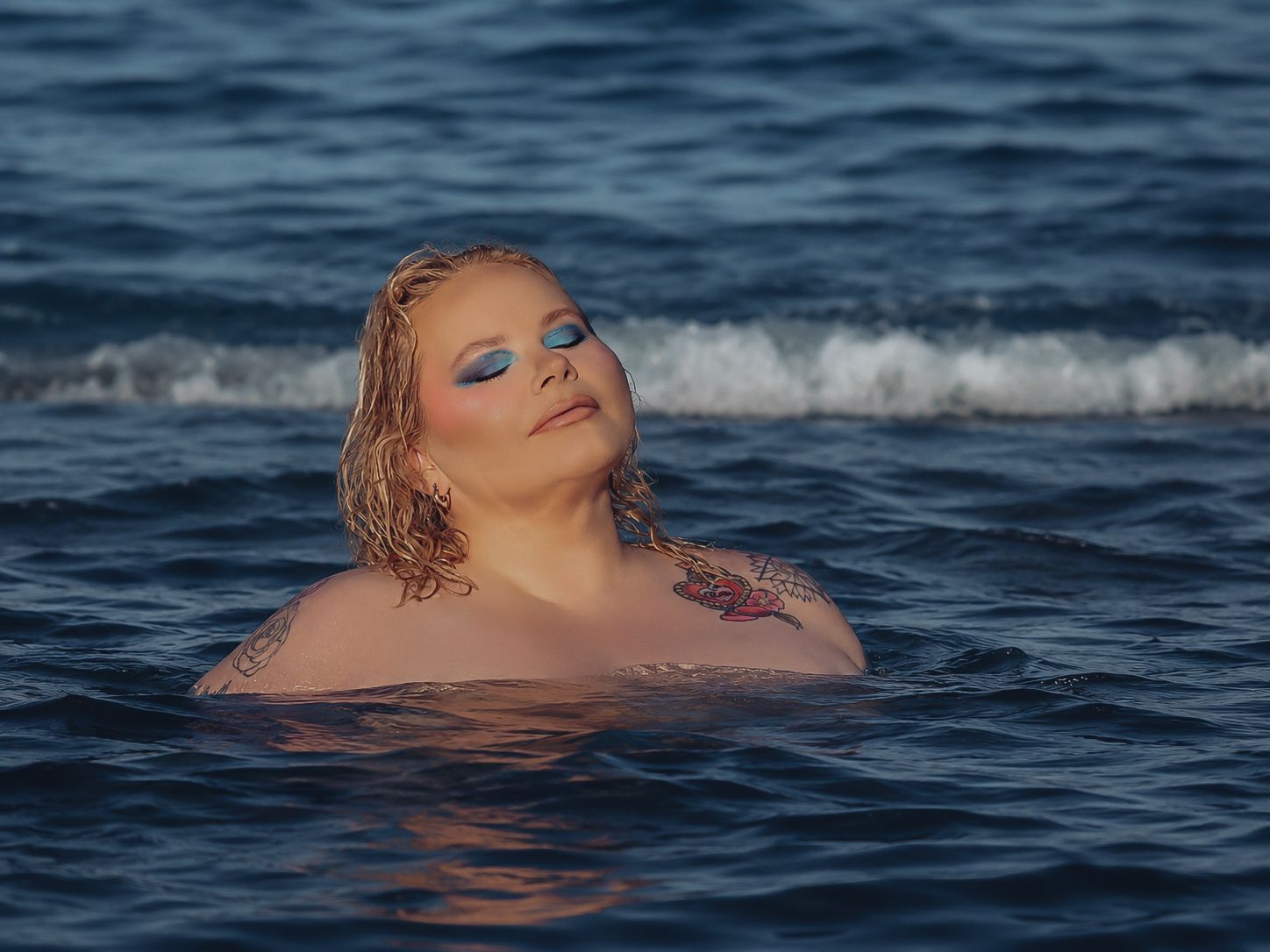 Outdoor boudoir photoshoot in water with dramatic style by Boudoir by Bri in St. Louis Missouri