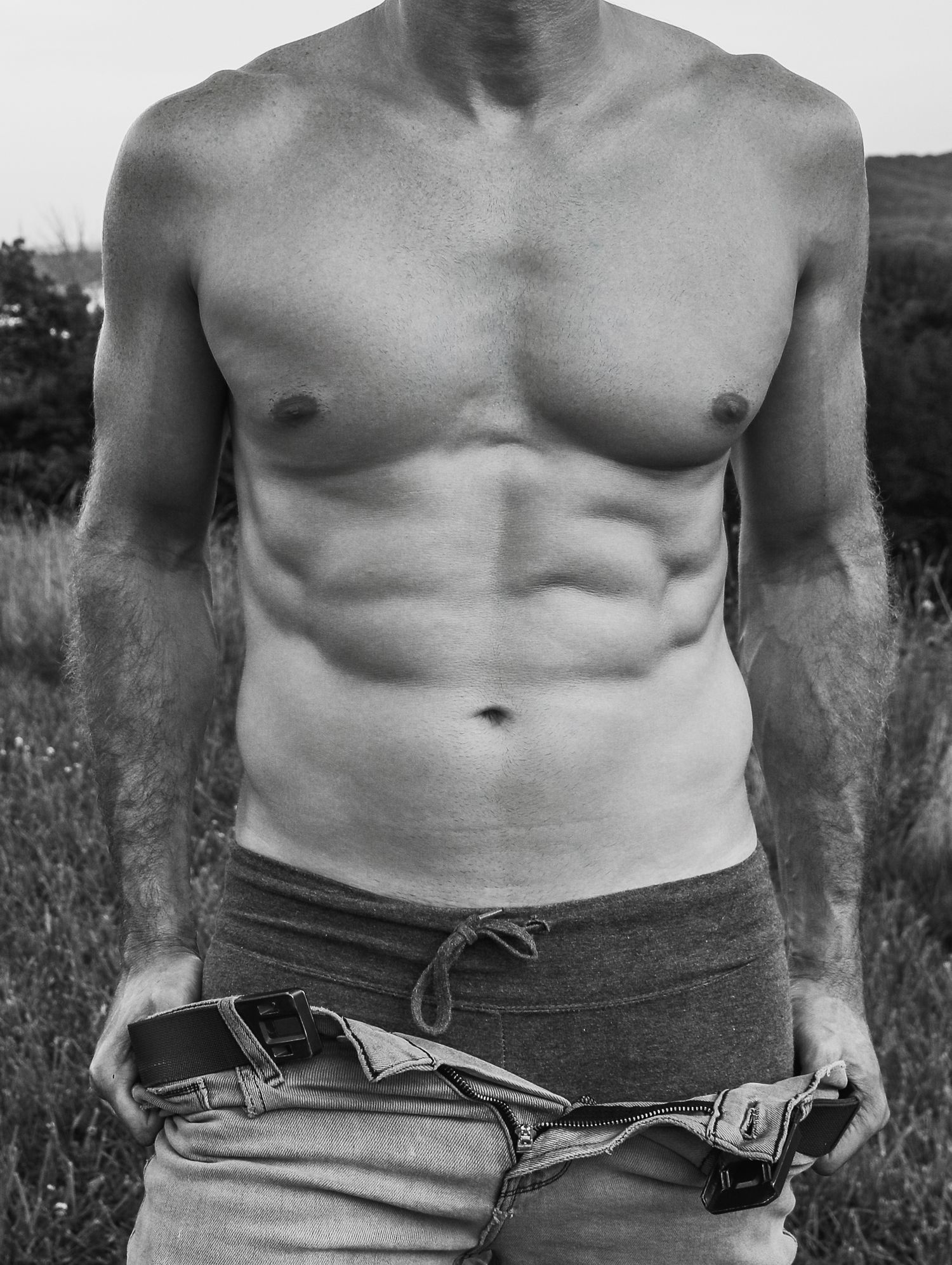 Male boudoir outdoor photoshoot detailed shots of abs, pulling jeans down black and white with Boudoir by Bri in Saint Louis