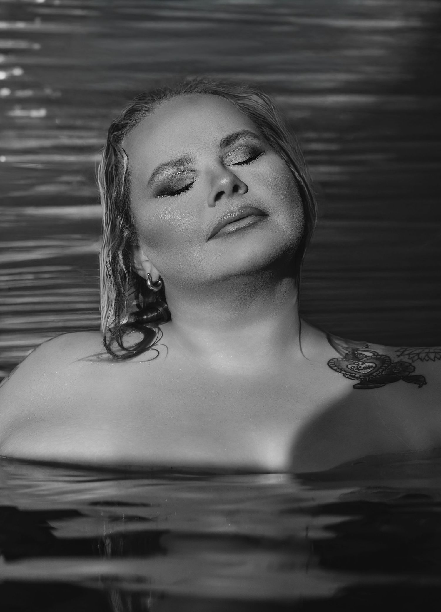 Outdoor boudoir photoshoot in water with dramatic style by Boudoir by Bri in St. Louis Missouri