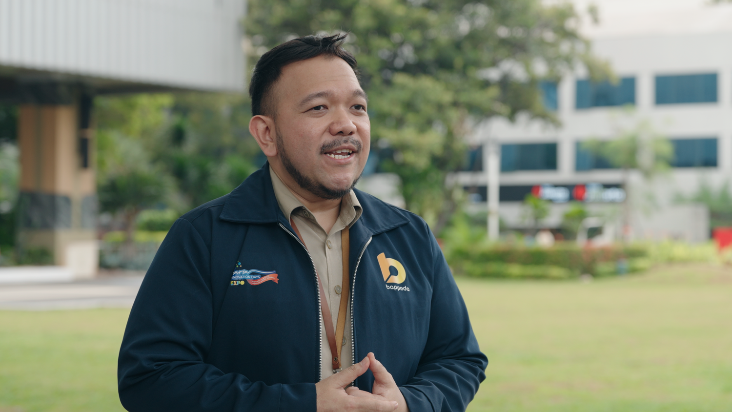 Indonesian government talking in front of a camera