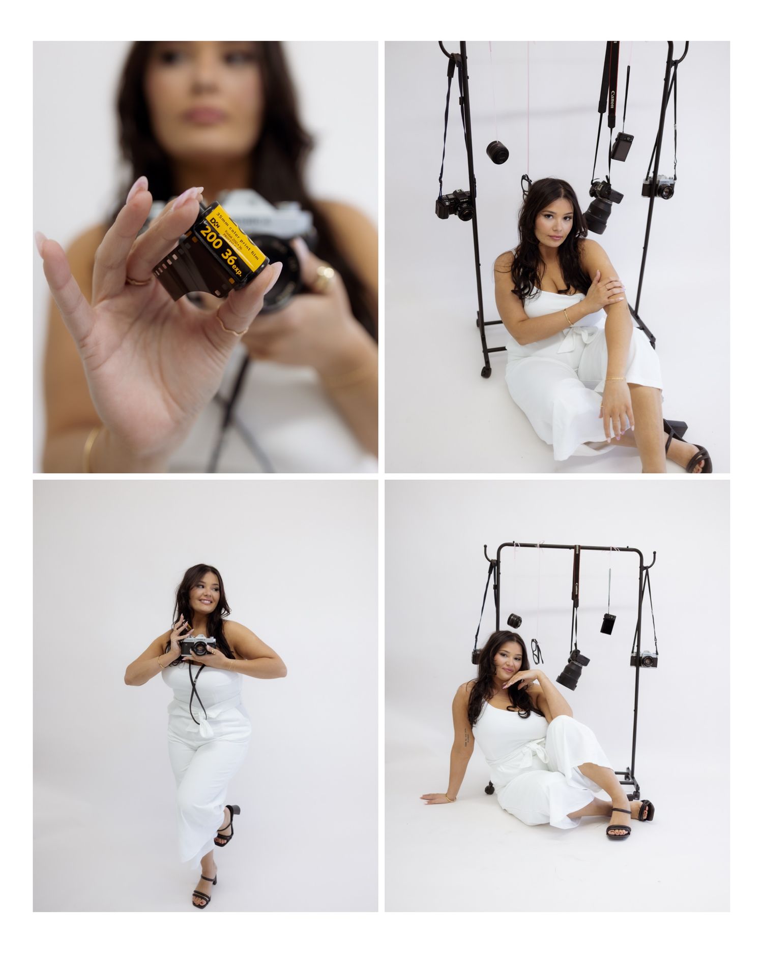 A figure in a white dress poses artistically with a black camera against a light studio backdrop.