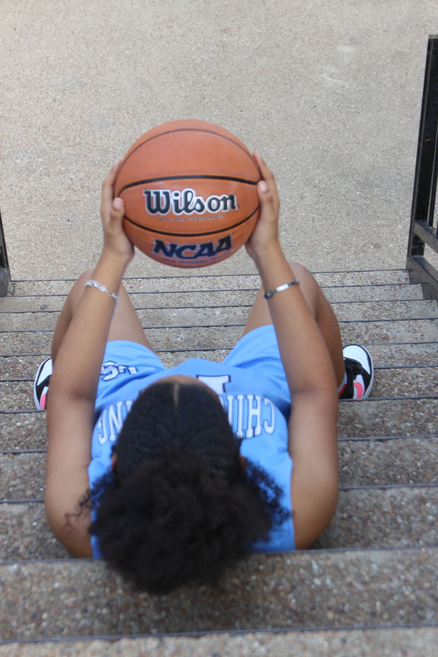 holding basketball