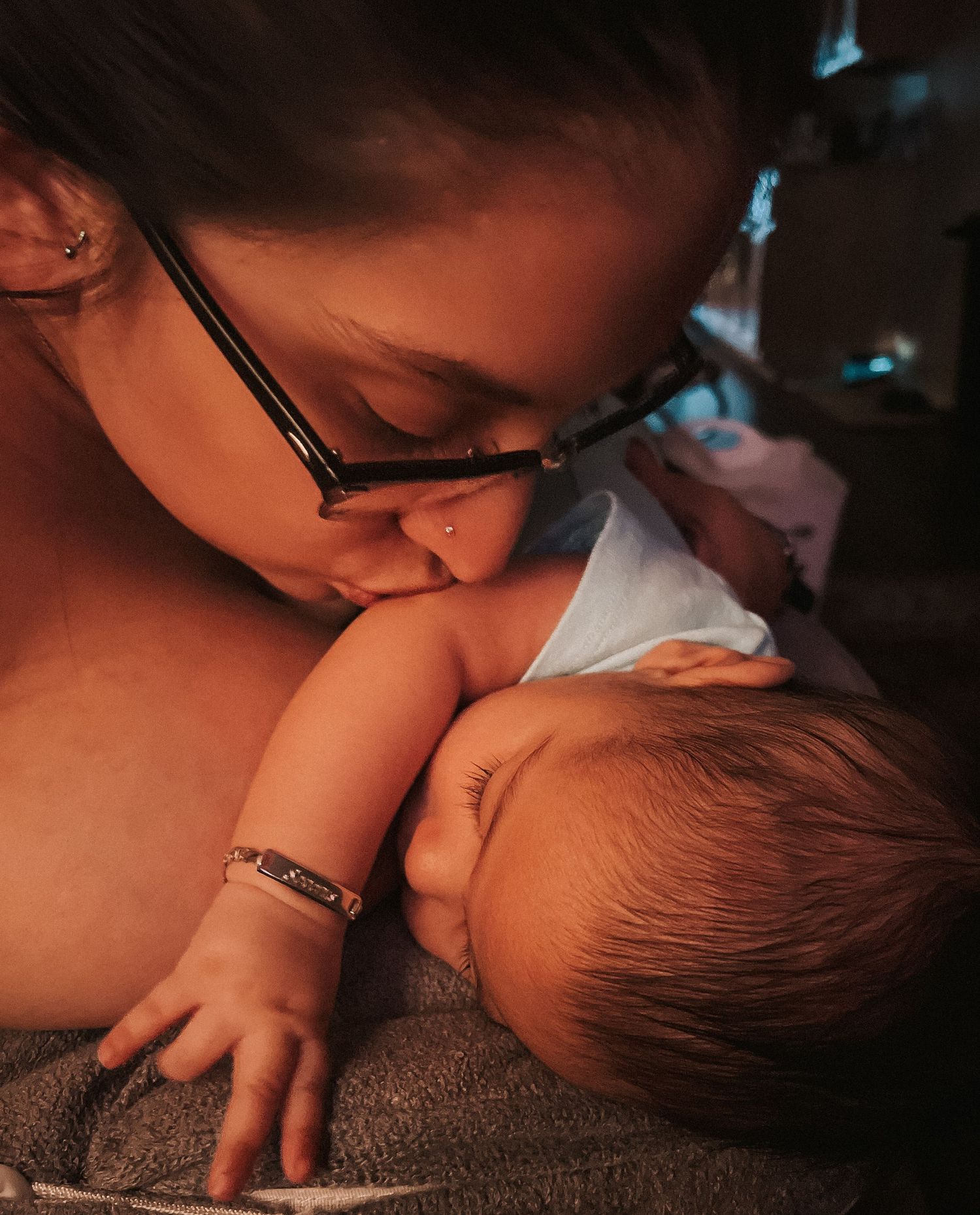 Mama kissing baby