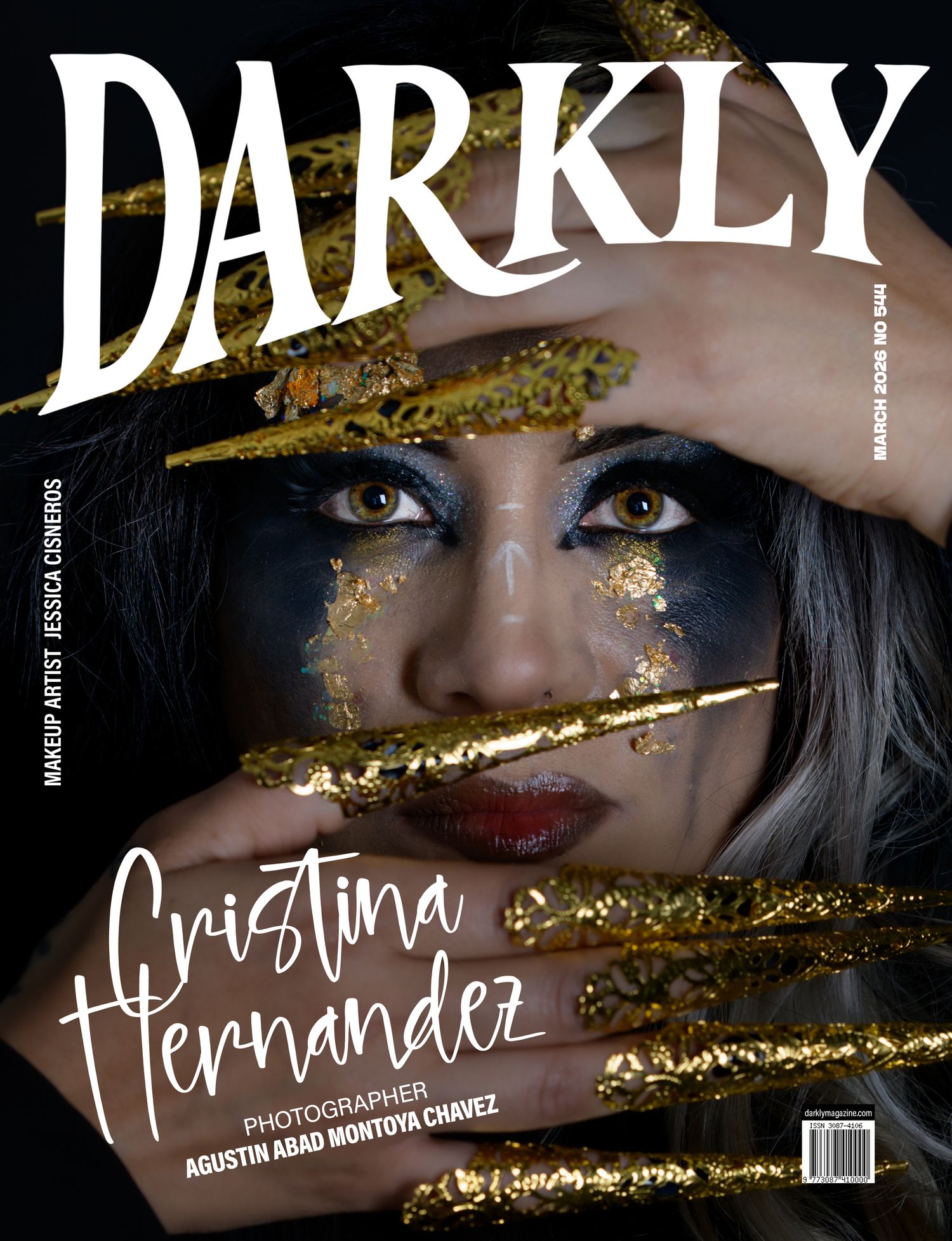 Darkly magazine cover featuring Cristina Hernandez with dramatic blue and gold makeup and long gold stiletto nails framing her eyes.
