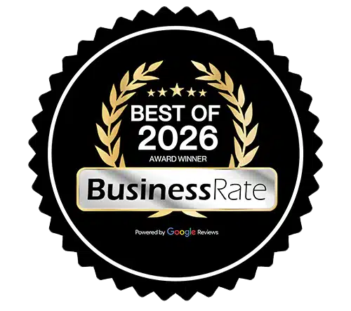 Black circular Best of 2026 award badge with gold laurel wreath and stars, featuring the BusinessRate logo powered by Google Reviews.