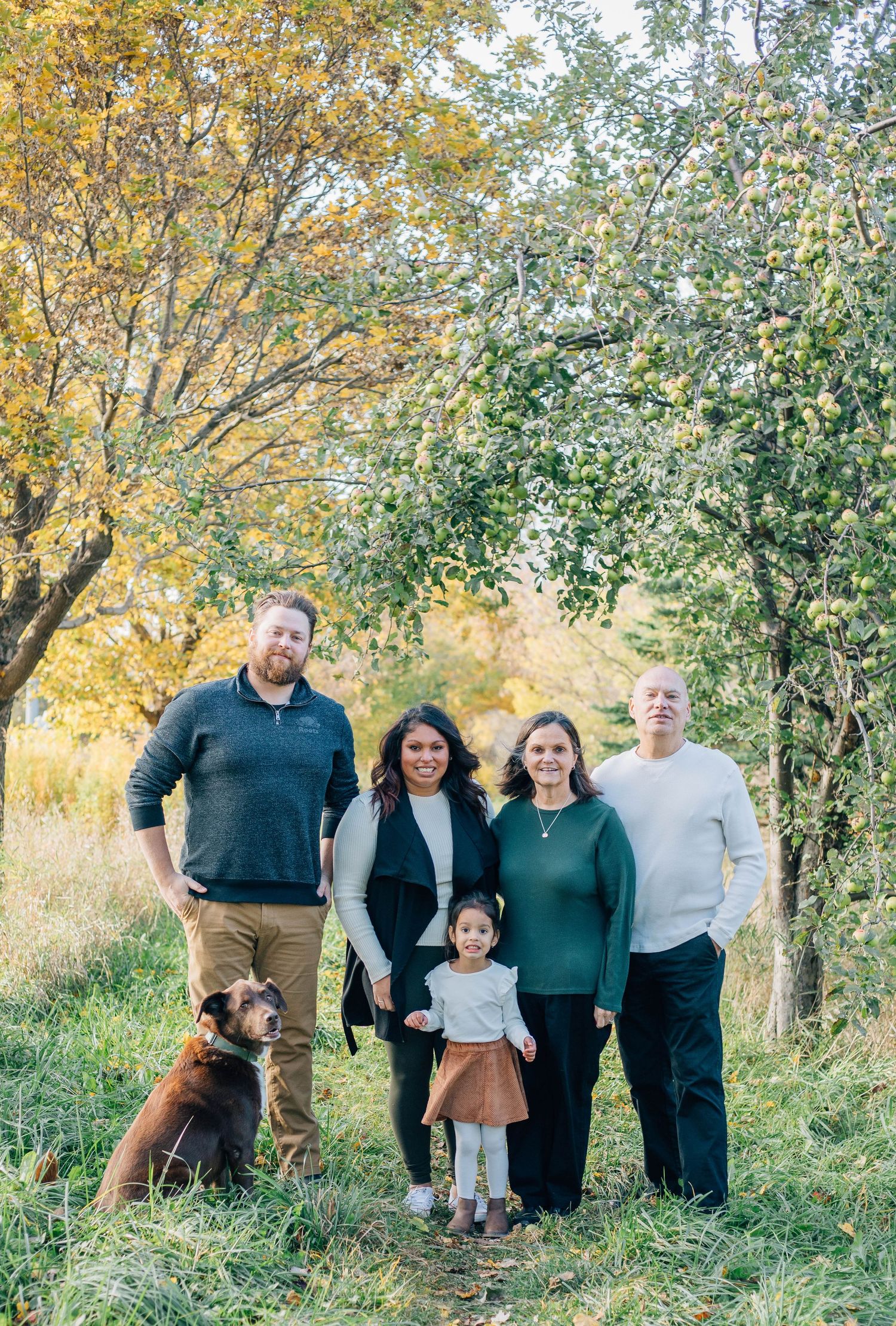 A family of 5 posing together for a picture in Stratford Ontario