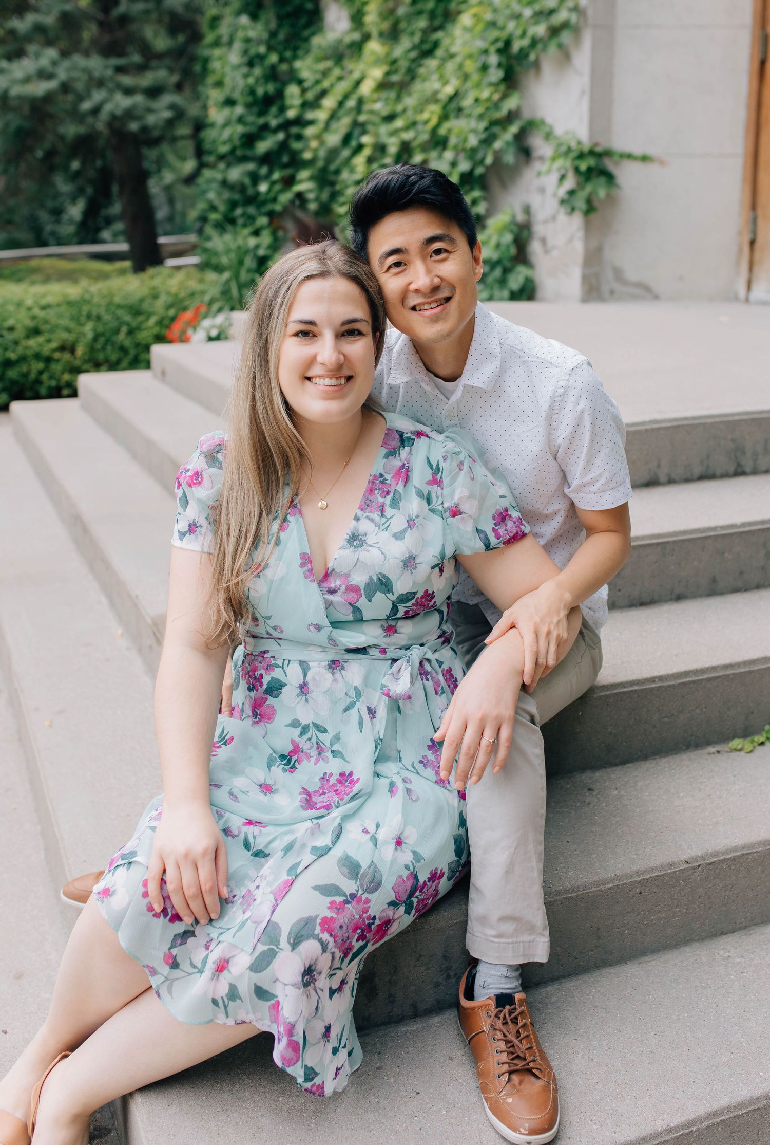 couple sitting on steps of the old courthouse in london ontario