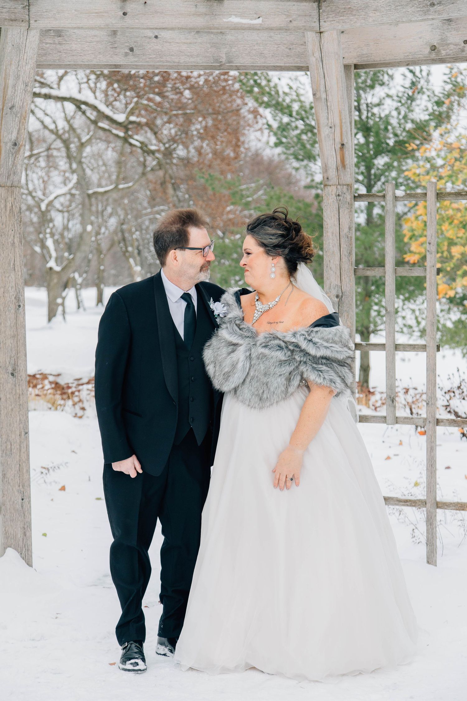 Couple standing outside the Stratford Country Club in the winer