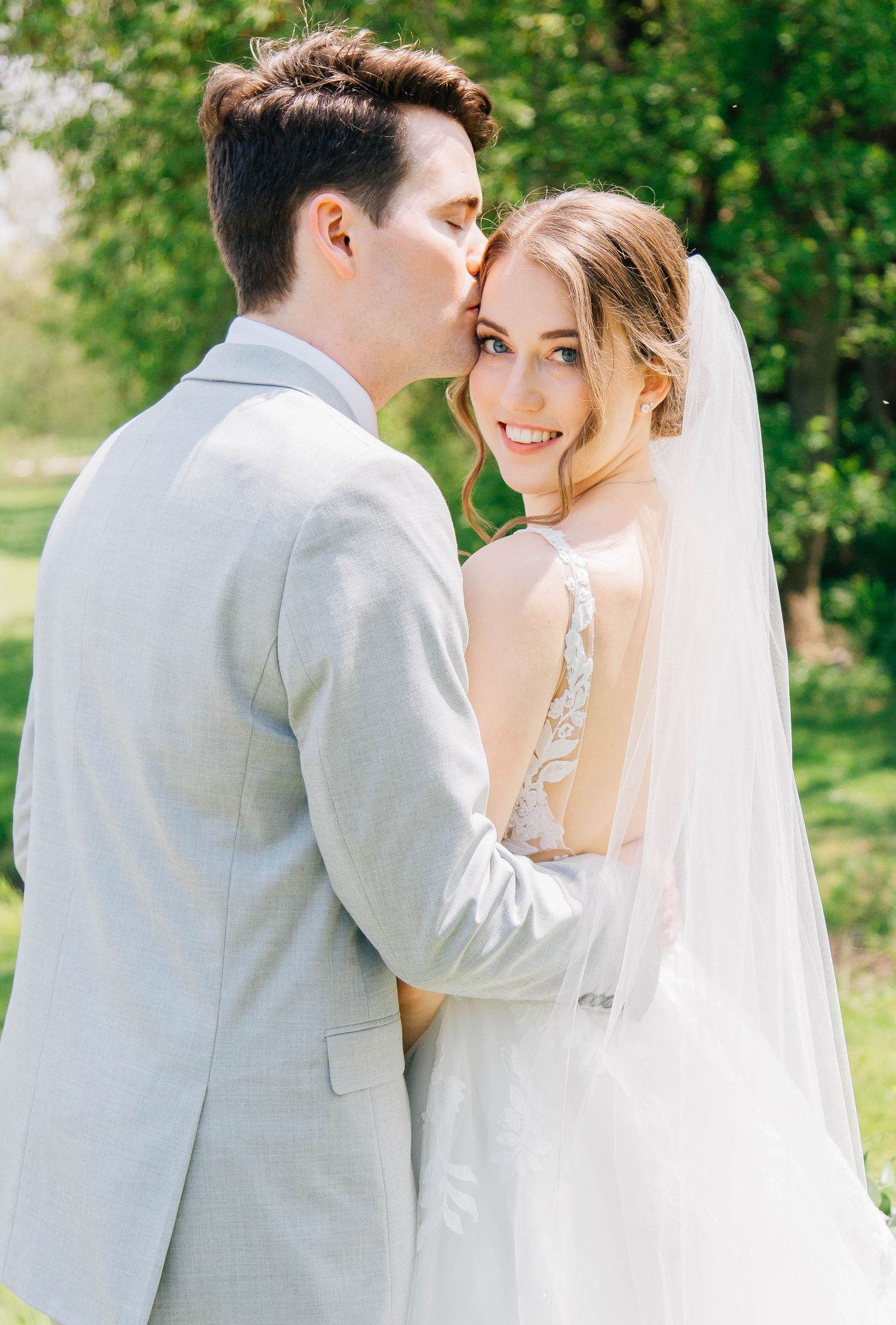 Groom kissing brides forehead in St. Jacob's Ontario