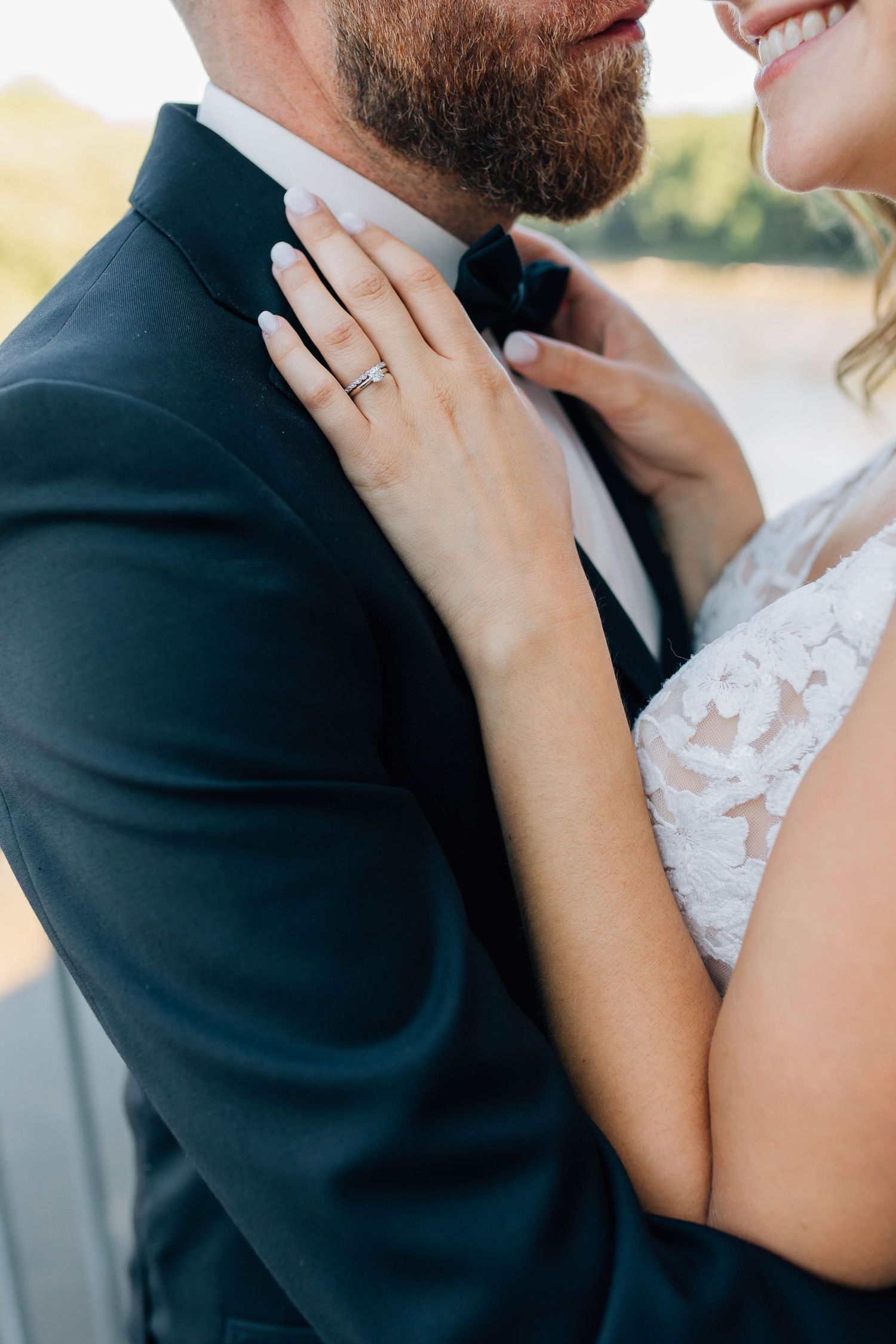 Close-up of bride showing diamond engagement ring on bridge in Paris Ontario.