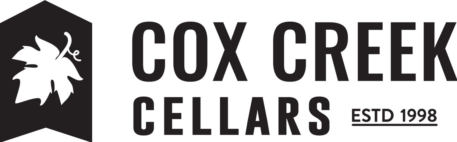 Cox Creek Cellars established 1998 winery logo with grape leaf icon in bold black design.