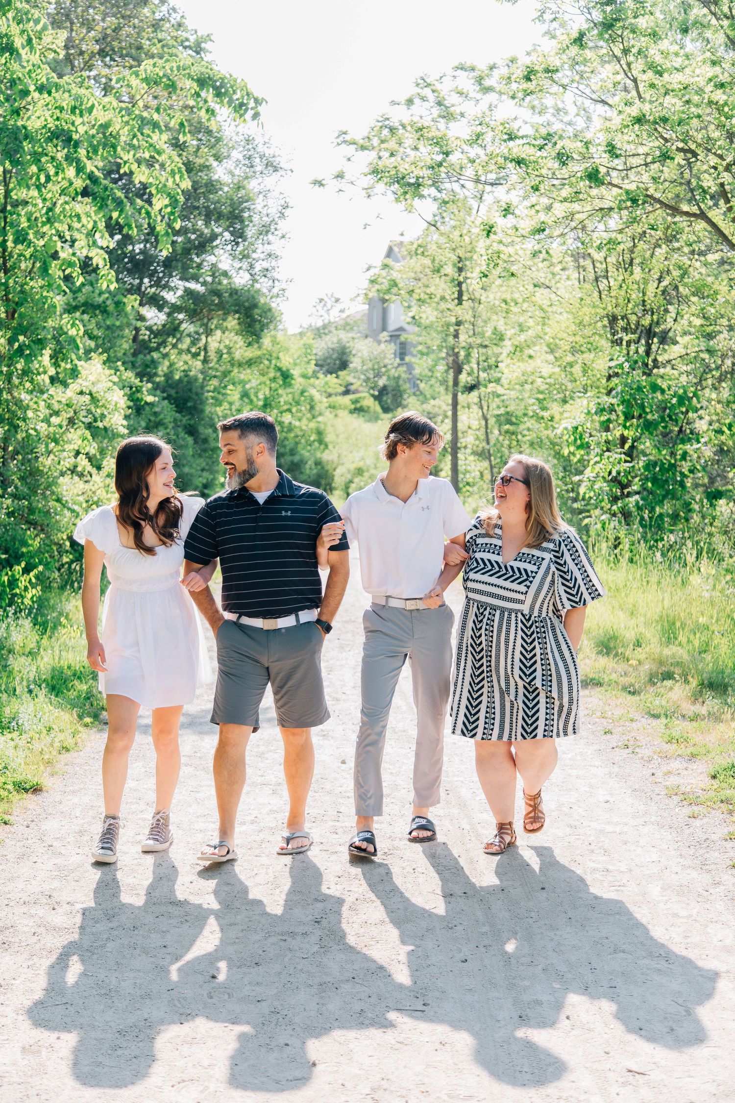 Family walking together along a trail in Kitchener Ontario