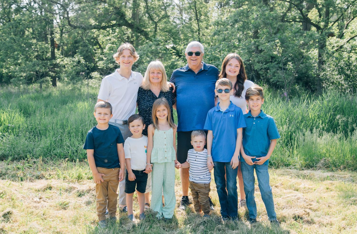 Grandparents standing with their grandkids on trail in Kitchener Ontario