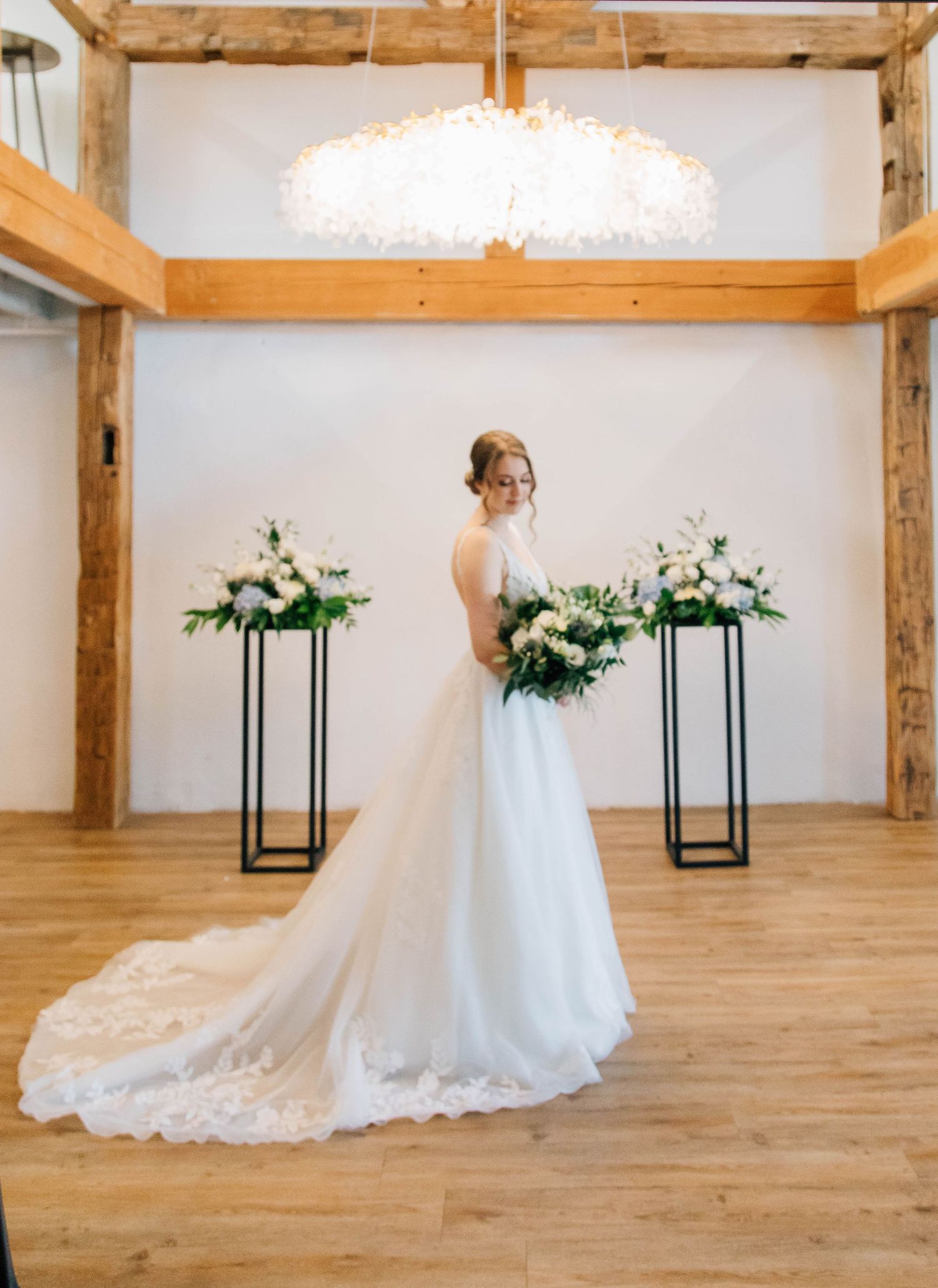 Bride standing in ceremony space at the Timber Barn in St. Jacob's Ontario