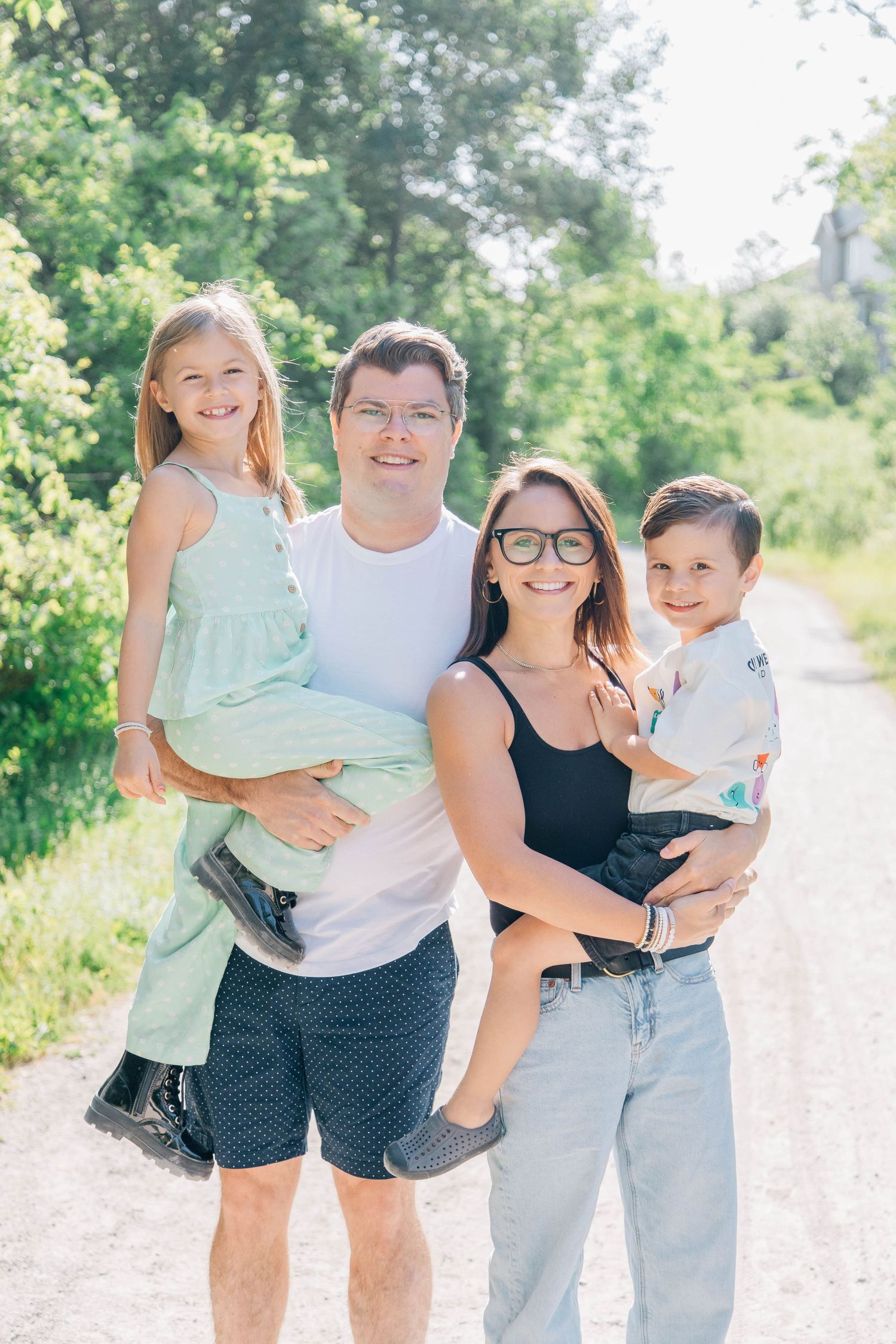 Family smiling on a trail in Kitchener Ontario