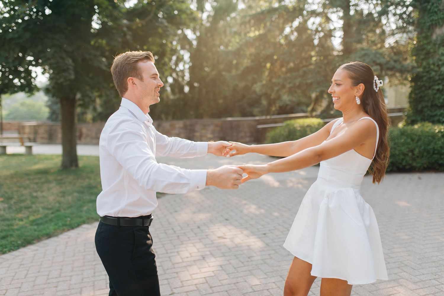 Couple dancing around during engagement session in London Ontario
