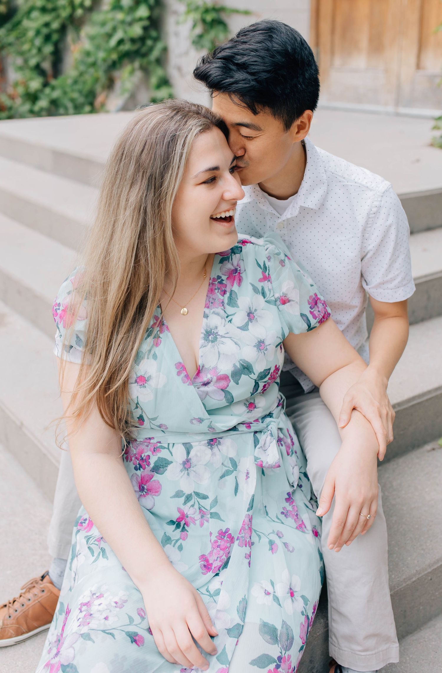 couple being candid and smiling in london ontario during their engagement session