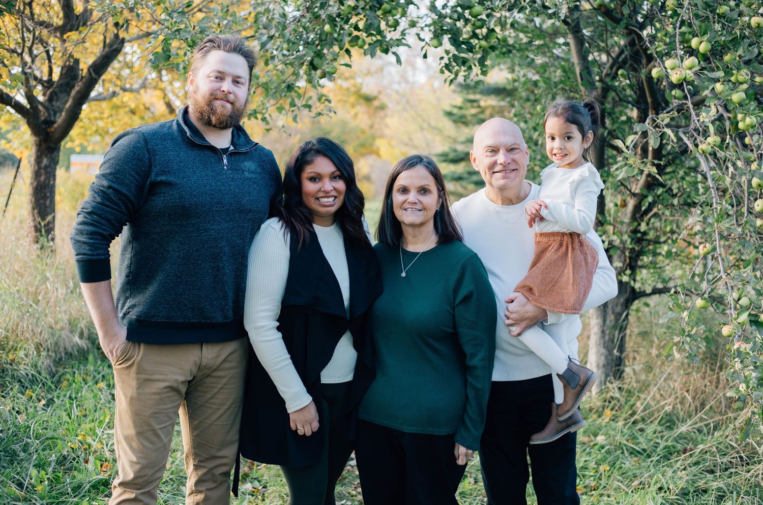 Family of 5 smiling on a fall day in Stratford Ontario