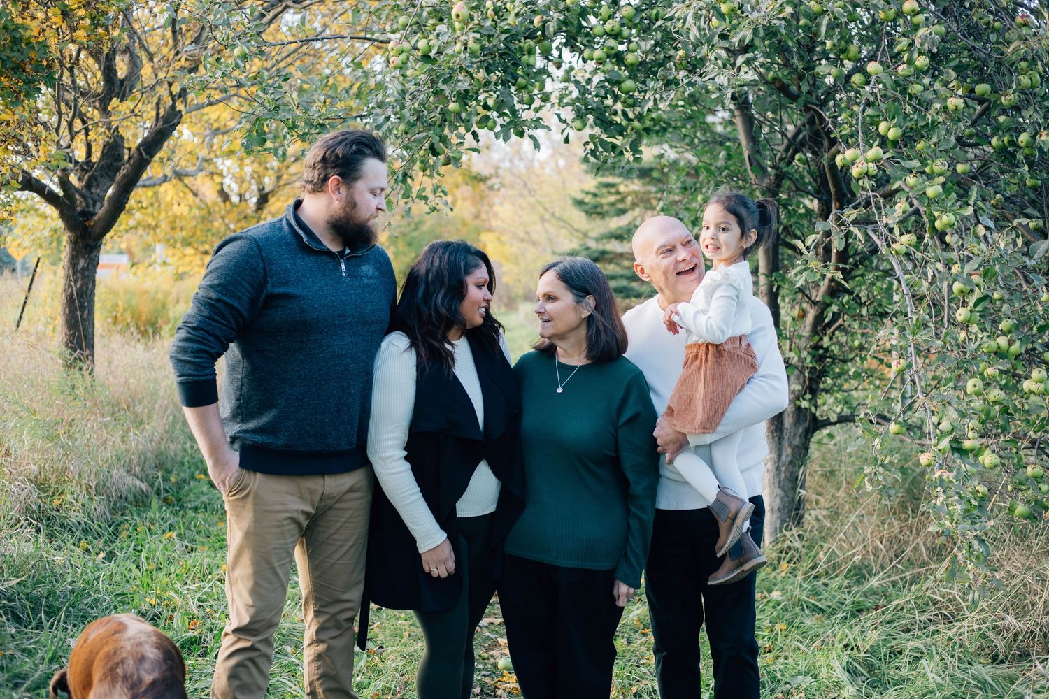 A family of 5 posing together for a picture in Stratford Ontario