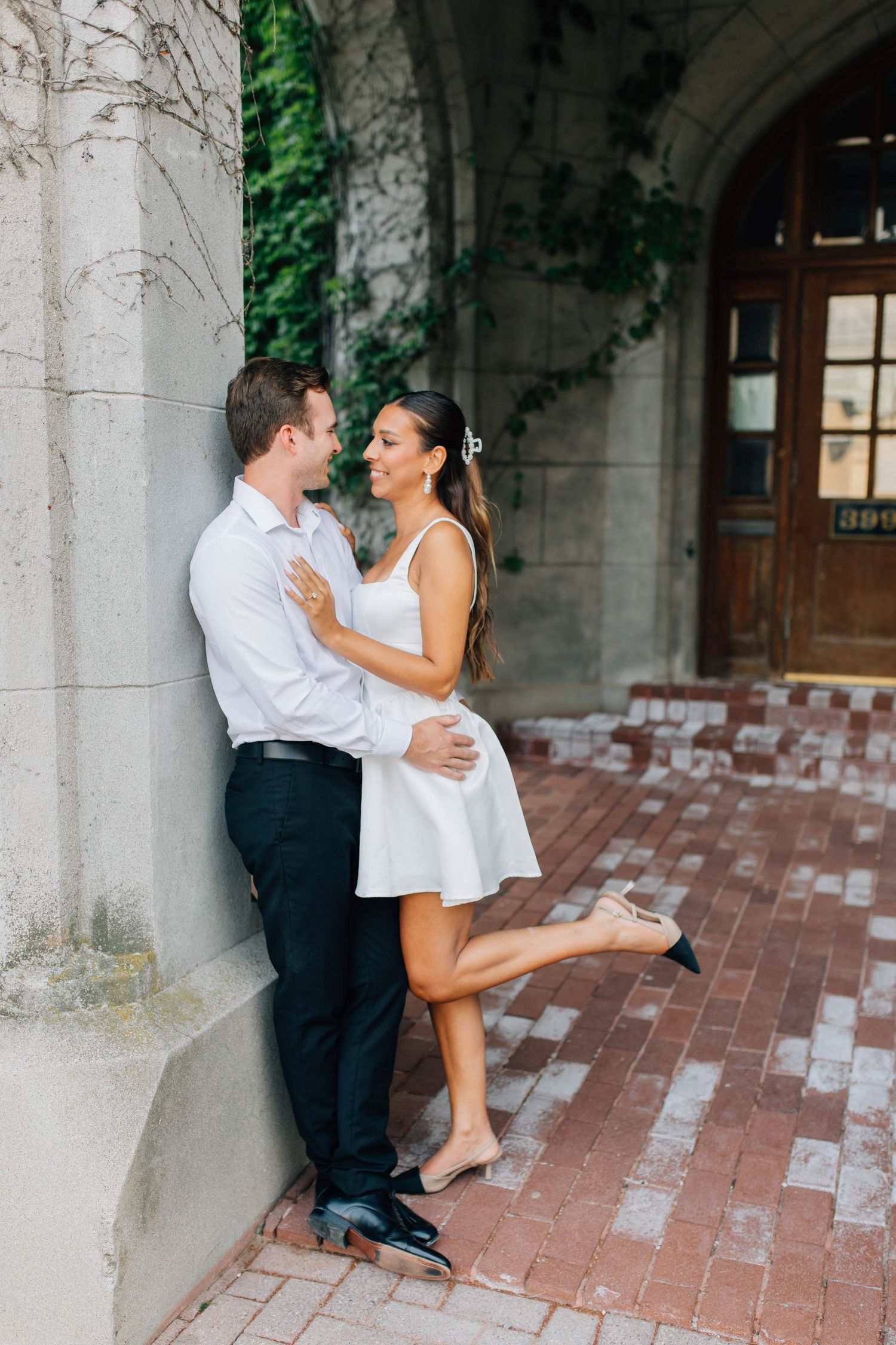 Bride and groom leaning in to one another at the Old Courthouse in London Ontario