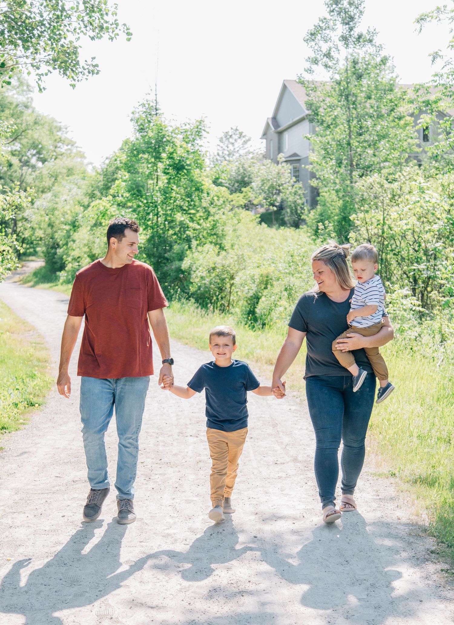 Family of four walking along trail in Kitchener Ontario