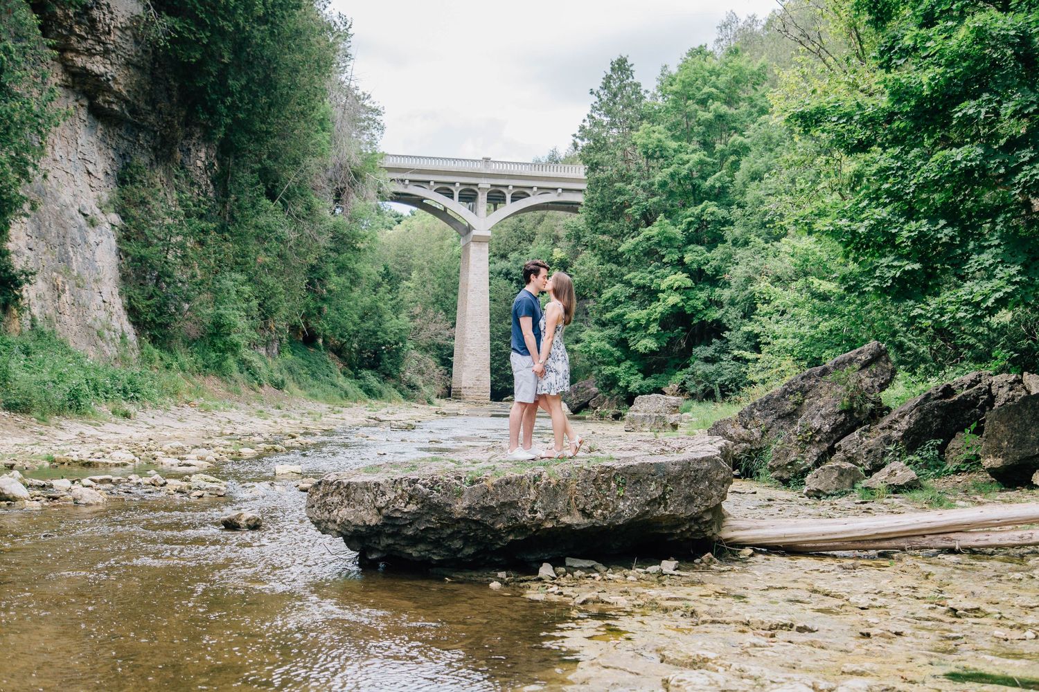 Couple kissing on a rock at Elora Gorge