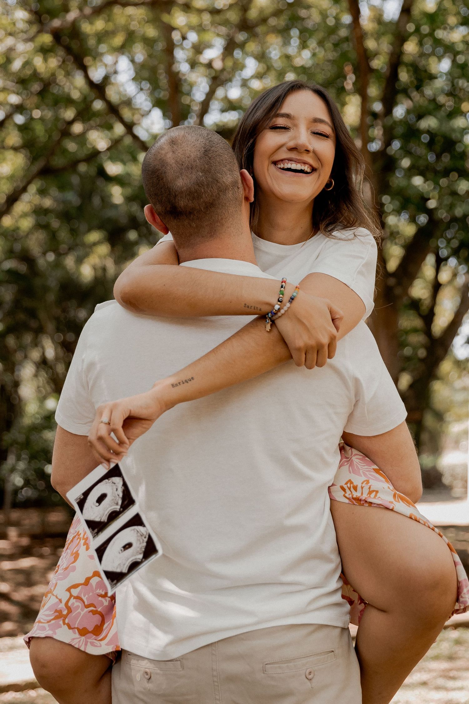 A couple shares intimate embraces in a series of candid outdoor photos with natural sunlit backgrounds.