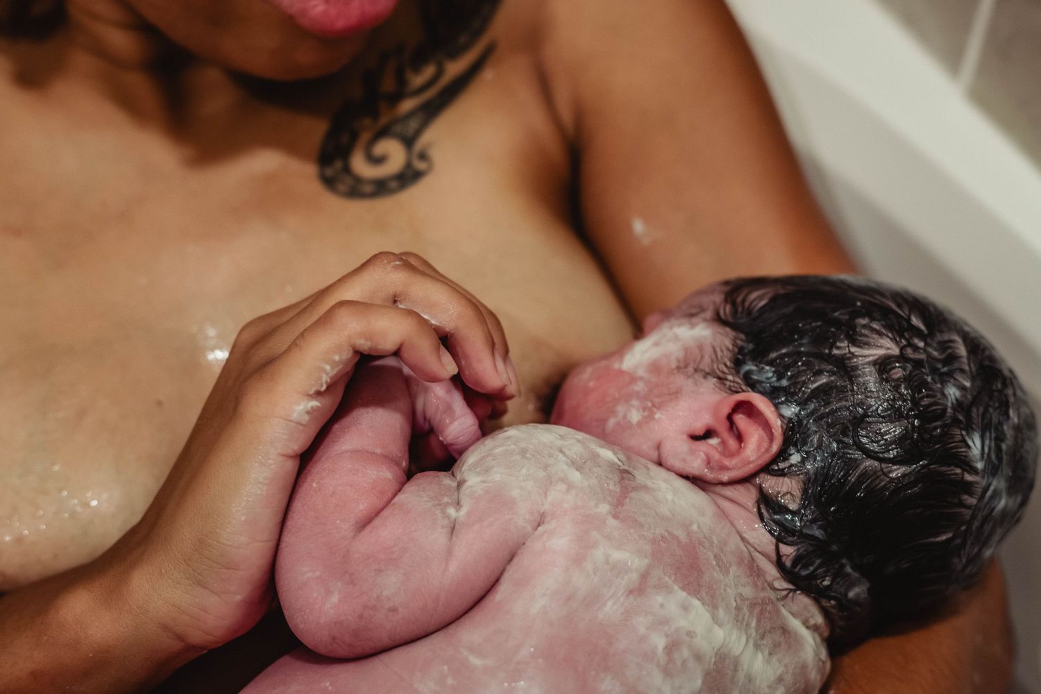 baby covered in vernix nurses