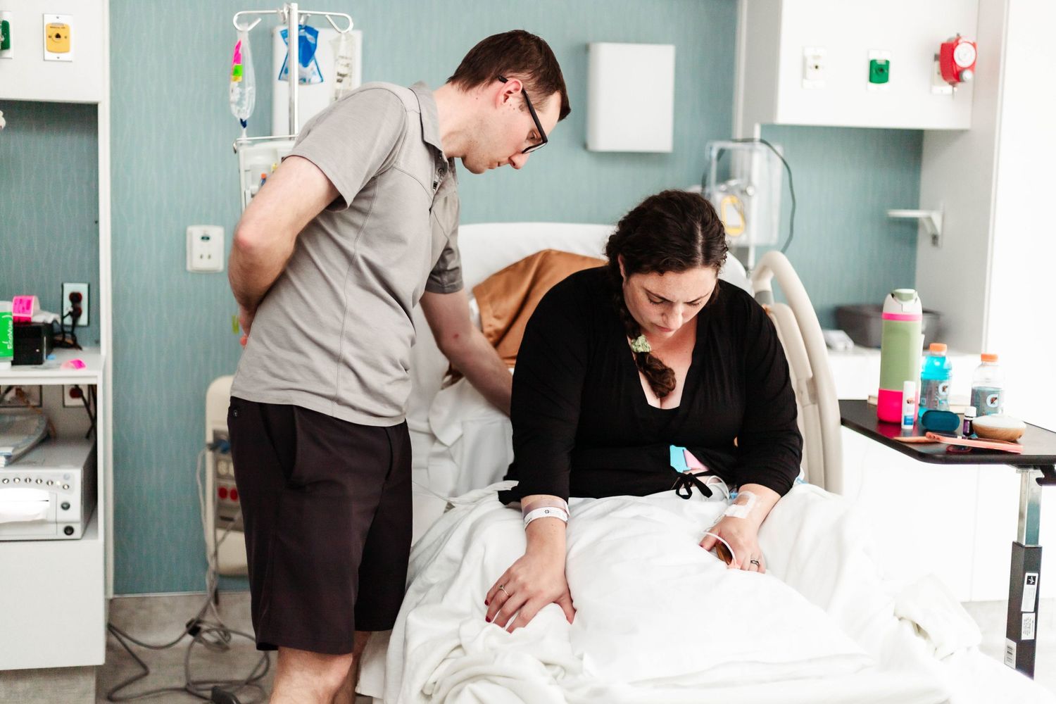 Husband massages wife's back during labor