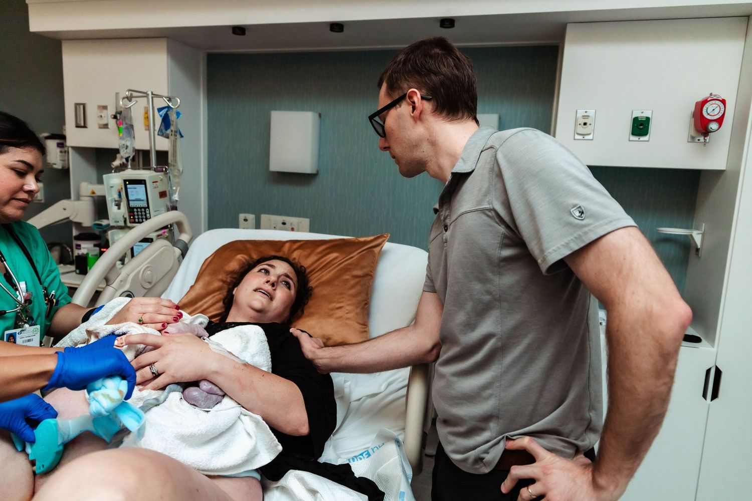 The look shared between husband and wife after delivery of their baby girl