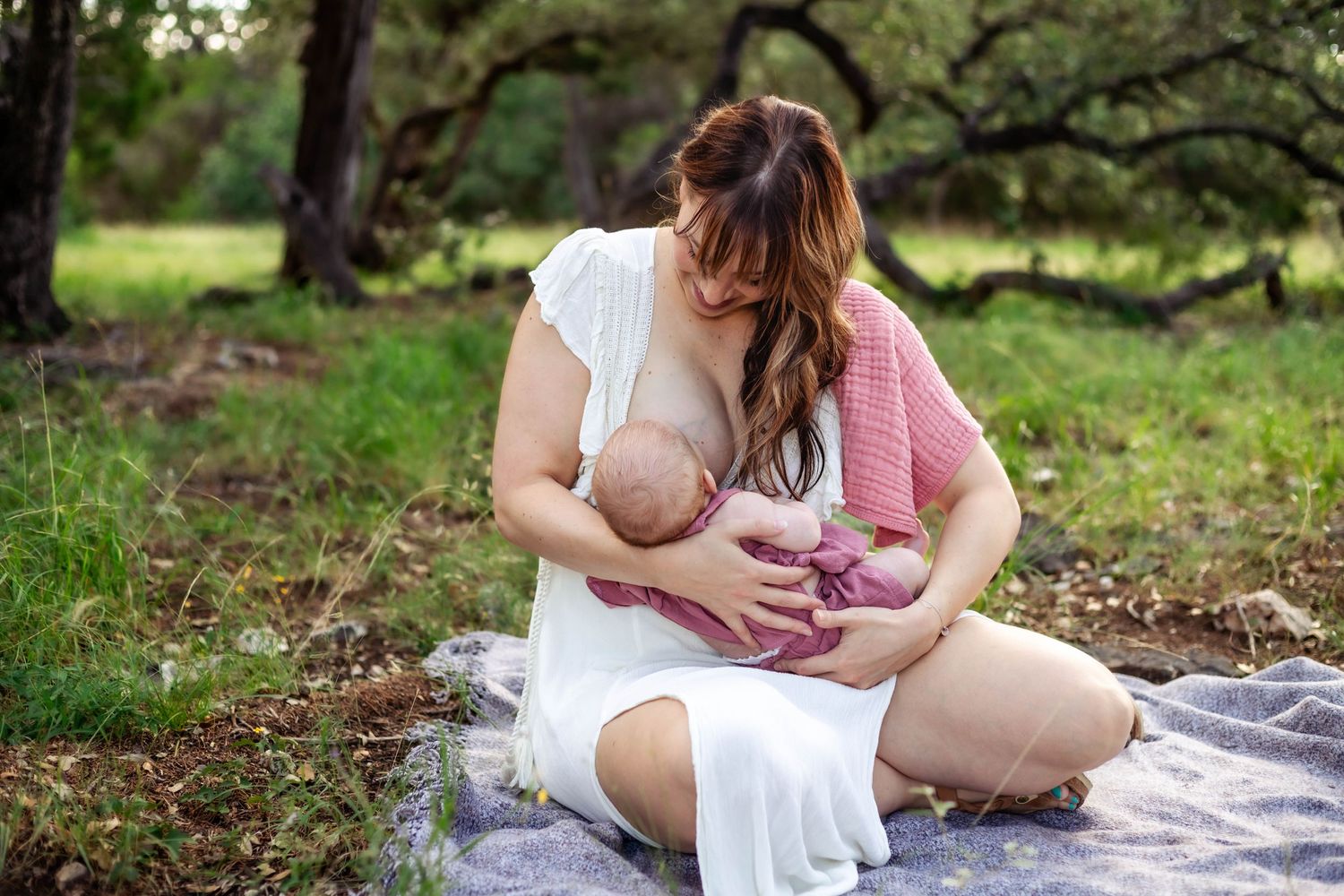 Mother nurses small baby at local New Braunfels and San Antonio breastfeeding event
